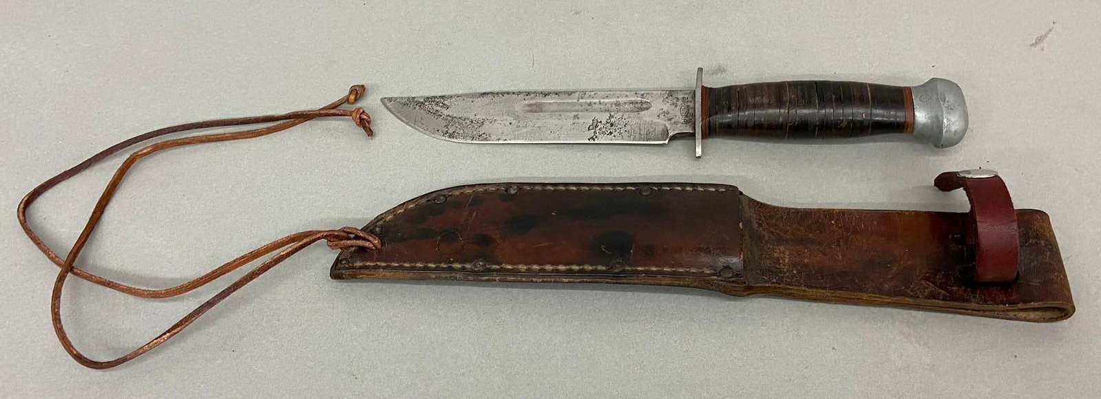WWII US RH PAL 36 FIGHTING KNIFE & LEATHER SHEATH: World War Two RH PAL Made in USA 36 fighting knife with the original leather sheath. Overall length is 11" with a 6.25" blade. Blade has been sharpened but not cleaned. In-house shipping is available.