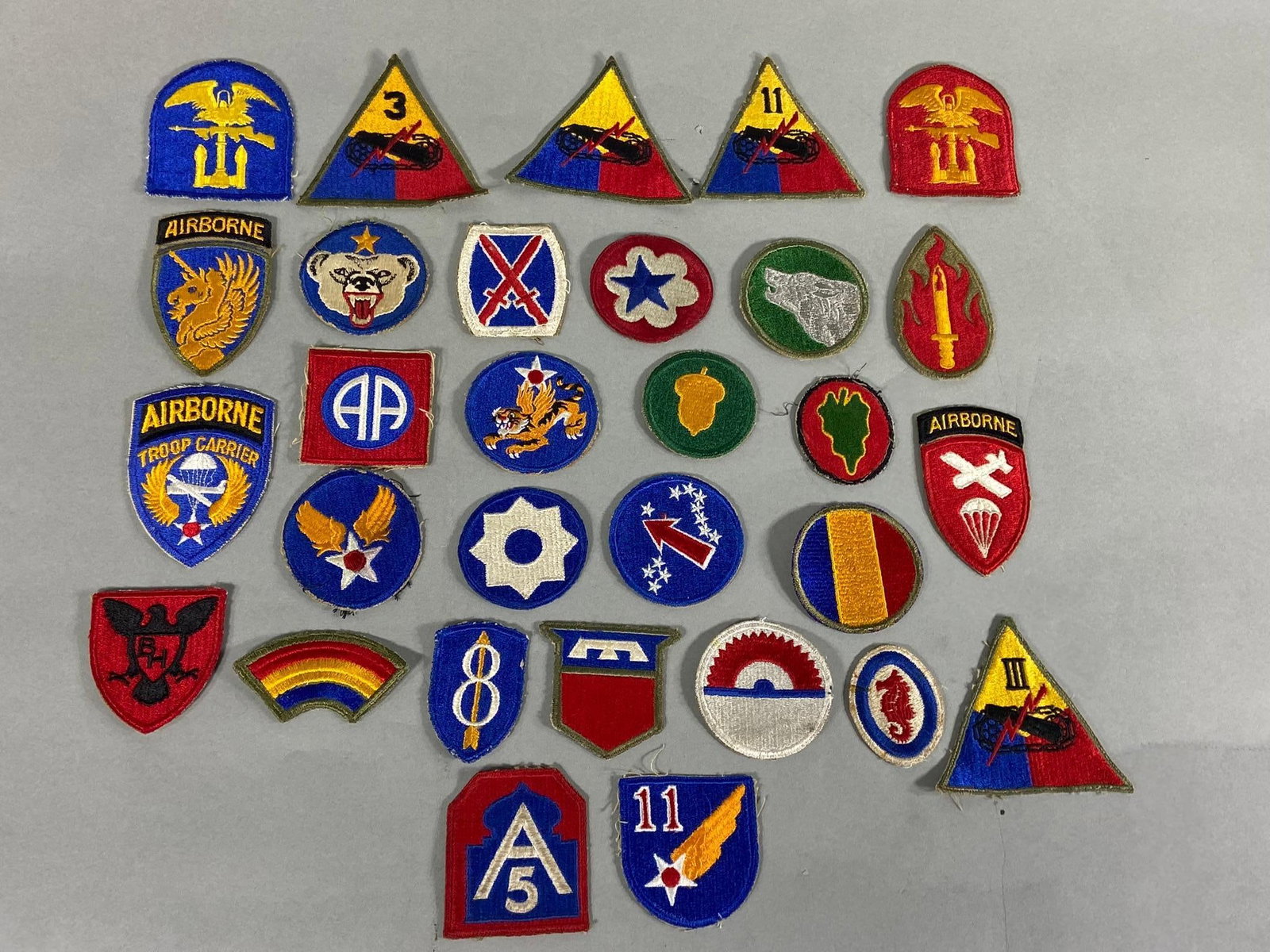 WWII PATCH LOT AIRBORNE ARMORED AAF DIVISION ETC: World War Two lot of 30 cut edge patches including 82nd Airborne, 14th Army Air force, 3rd Armored division, 104th Infantry Division, Alaska Command, Amphibious Engineers, etc. etc. In-house shipping 
