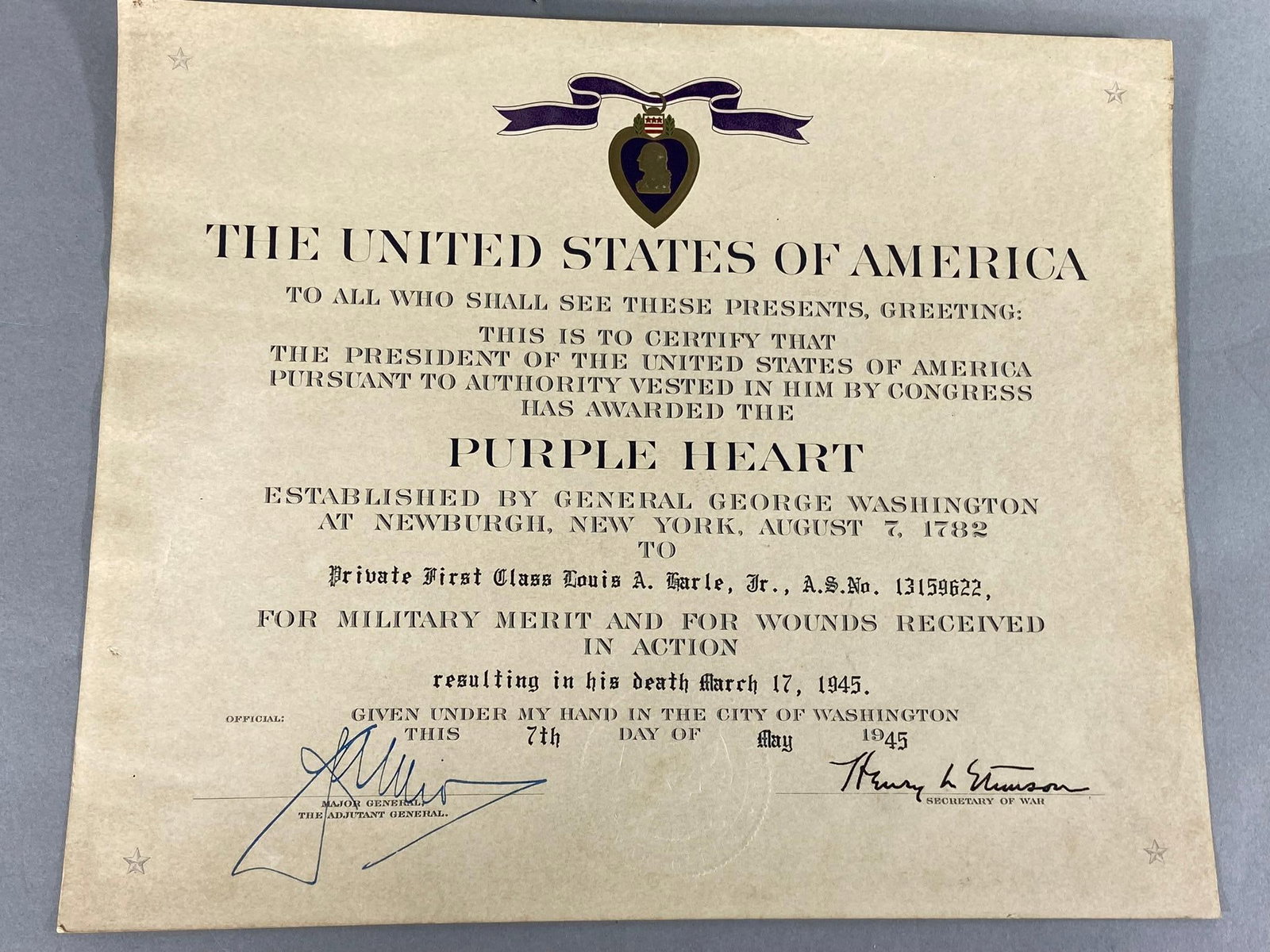 WWII KIA PURPLE HEART CERTIFICATE: World War Two KIA Purple Heart certificate for Private First Class Louis A Earle Jr. for wounds received in action resulting in his death March 17, 1945. In-house shipping is available. Pickup is Thur