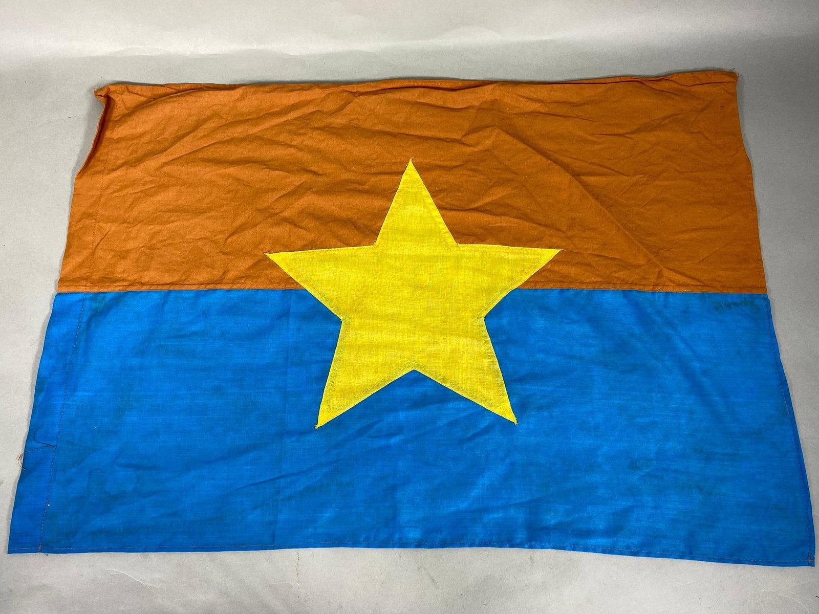 VIETNAM WAR VIET CONG BATTLE FLAG: Original Viet Cong multipiece construction flag. Cut out center has applied yellow star. Measures 21.5" x 30". Minor staining otherwise excellent condition. In-house shipping is available. Pickup is T
