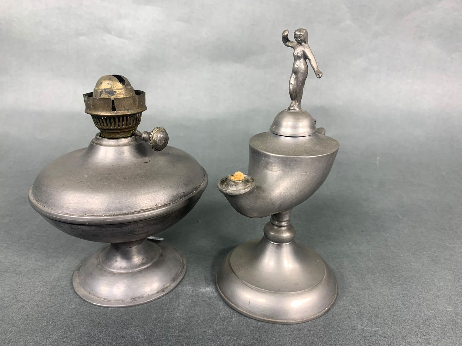 2 Antique Pewter Oil Lamps: 2 Antique Pewter Oil Lamps. To see up to 100 photos of this lot, please find this sale on LiveAuctioneers. In-house shipping is available. Pickup is Friday, April 5th from 12pm to 7pm in Carroll, Ohio