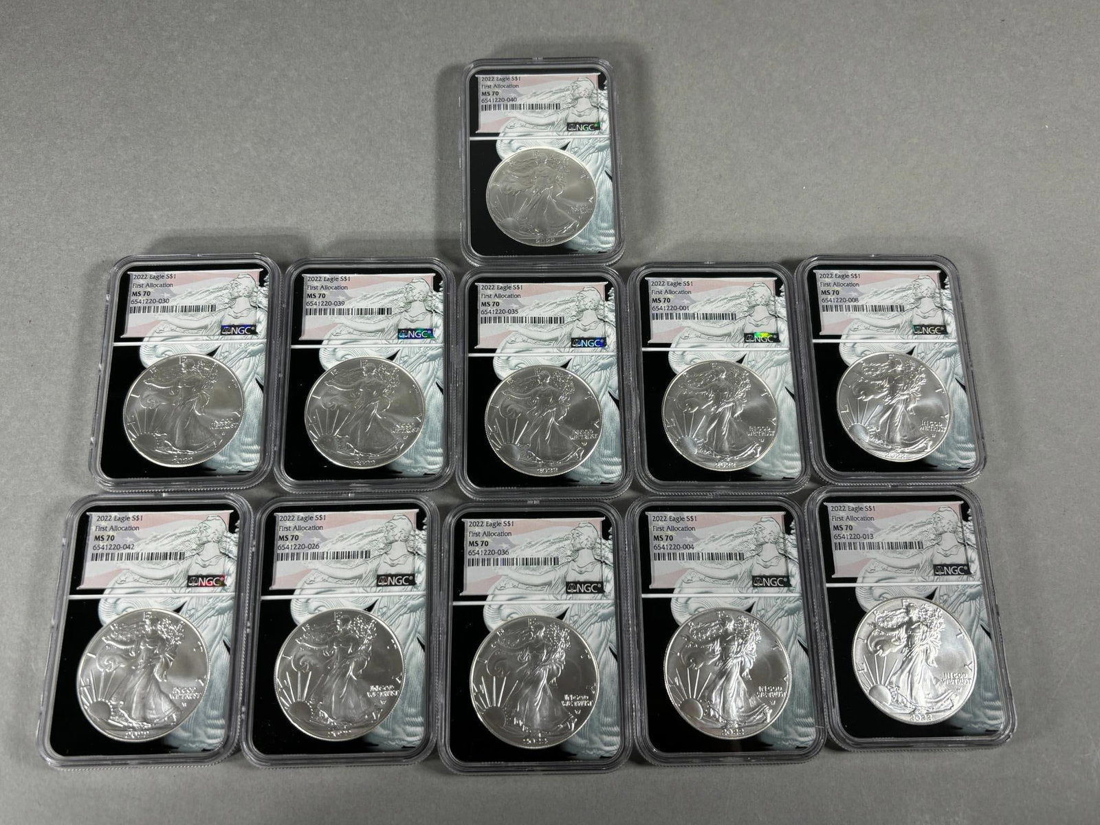 Group Lot of 11 US Silver Dollar Coins NGC Graded: Group Lot of 11 US Silver Dollar Coins NGC Graded. To see up to 100 photos of this lot, please find this sale on LiveAuctioneers. In-house shipping is available. Pickup is Friday, April 5th from 12pm 