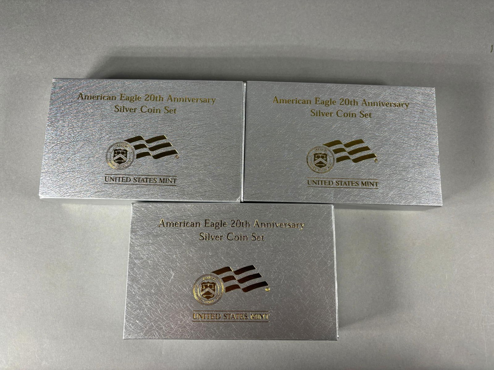 Group of 3 US Mint American Eagle 20th Anniv Silver Coin Sets: Group of 3 US Mint American Eagle 20th Anniv Silver Coin Sets. To see up to 100 photos of this lot, please find this sale on LiveAuctioneers. In-house shipping is available. Pickup is Friday, April 5t