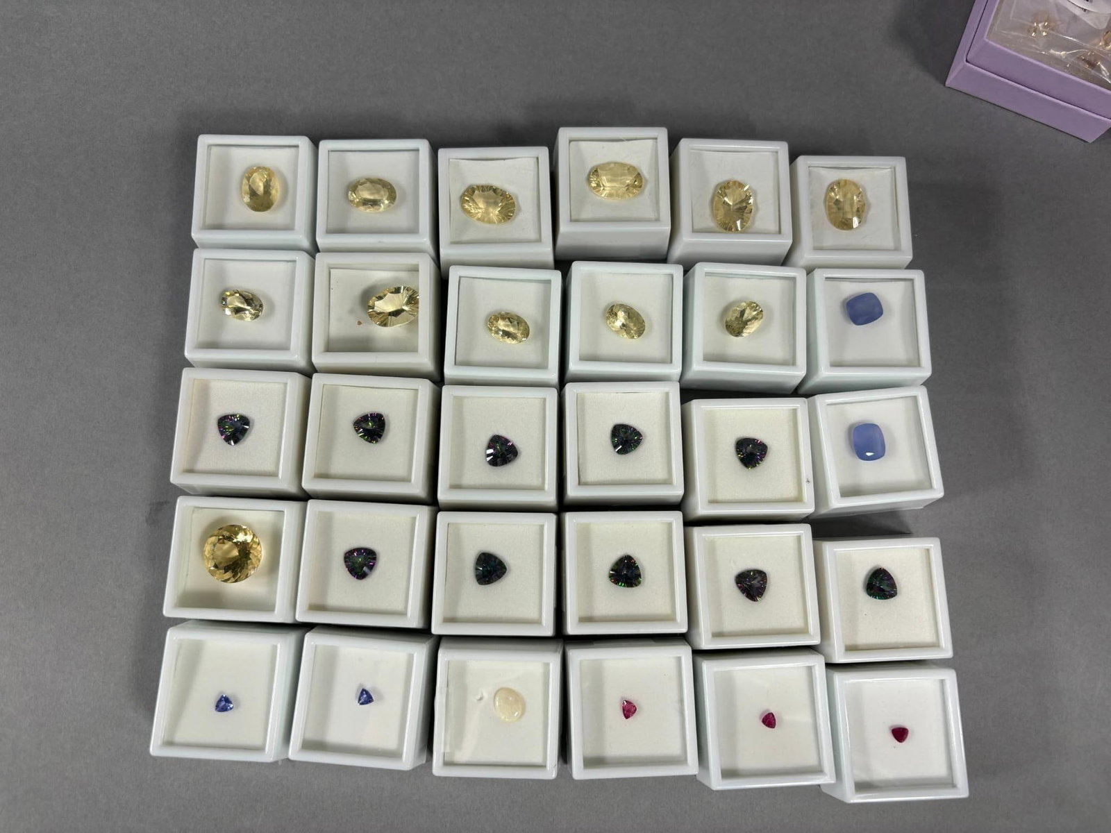 Group Lot of Gemstones in Cases Yellow Labradorite, Bixbite, Chalcedony etc: Group Lot of Gemstones in Cases Yellow Labradorite, Bixbite, Chalcedony etc. To see up to 100 photos of this lot, please find this sale on LiveAuctioneers. In-house shipping is available. Pickup is Fr