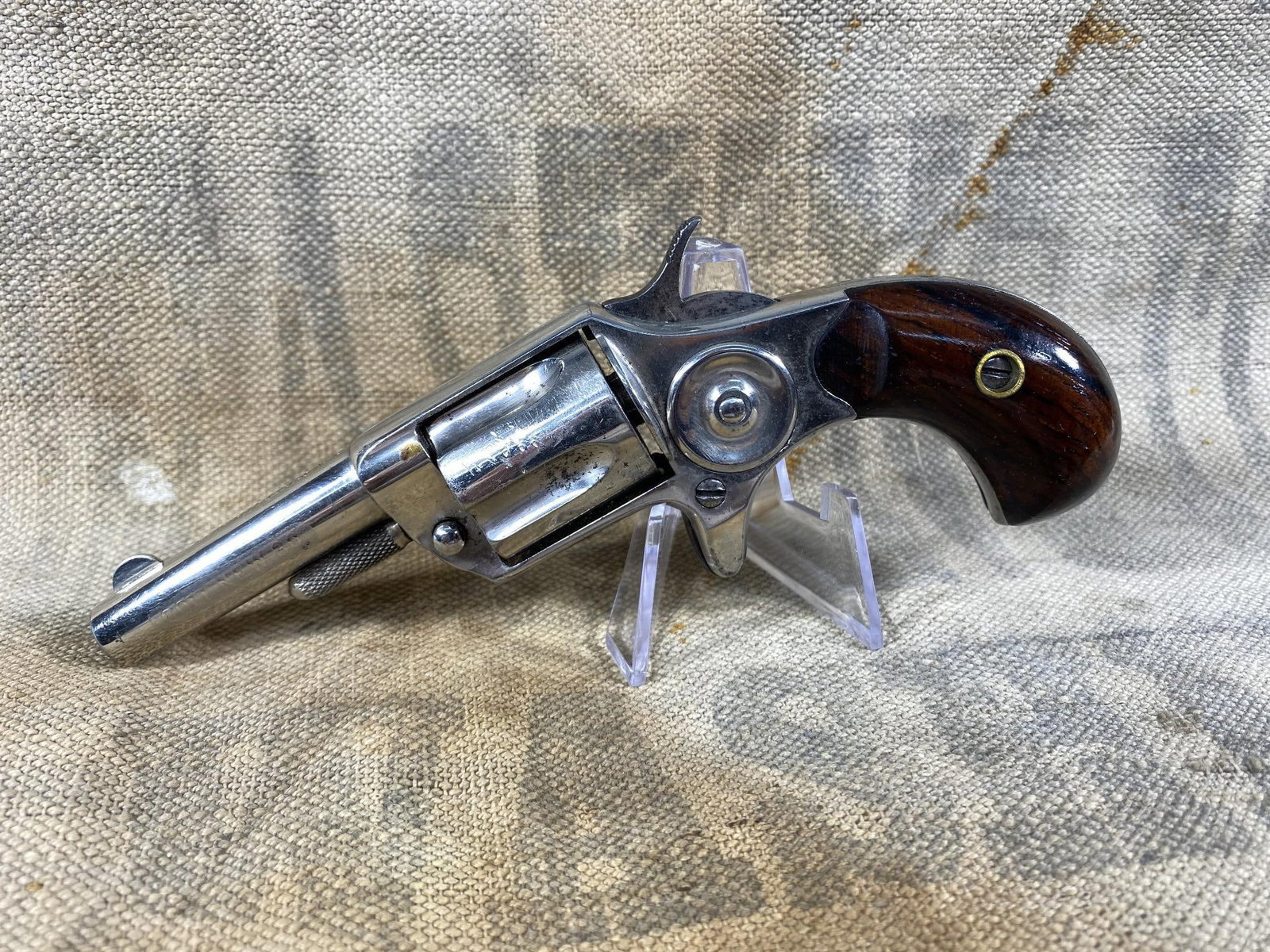COLT NEW LINE 30RF REVOLVER NICE ETCHED BARREL: BRAND: Colt MODEL: New Line SERIAL: 1543 CALIBER/GAUGE: 30RF CONDITION: Very good. Bore good, action good. SIZE: 2.25" bbl NOTES: Etched barrel. This firearm is Pre 1898 or percussion, so no backgroun