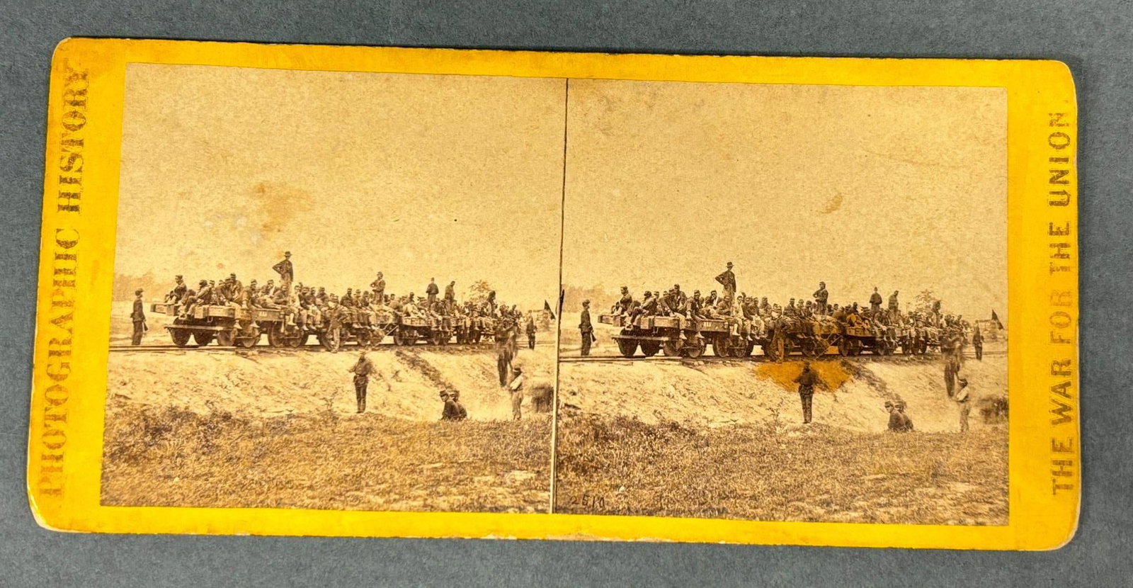 CIVIL WAR STEREOVIEW - WOUNDED AT SAVAGE STATION: Stereoview photograph of the "Wounded at Savage Station" published by E. & H. T. Anthony from a negative by Matthew Brady. Image features Union wounded soldiers on two open railcars. In-house shipping