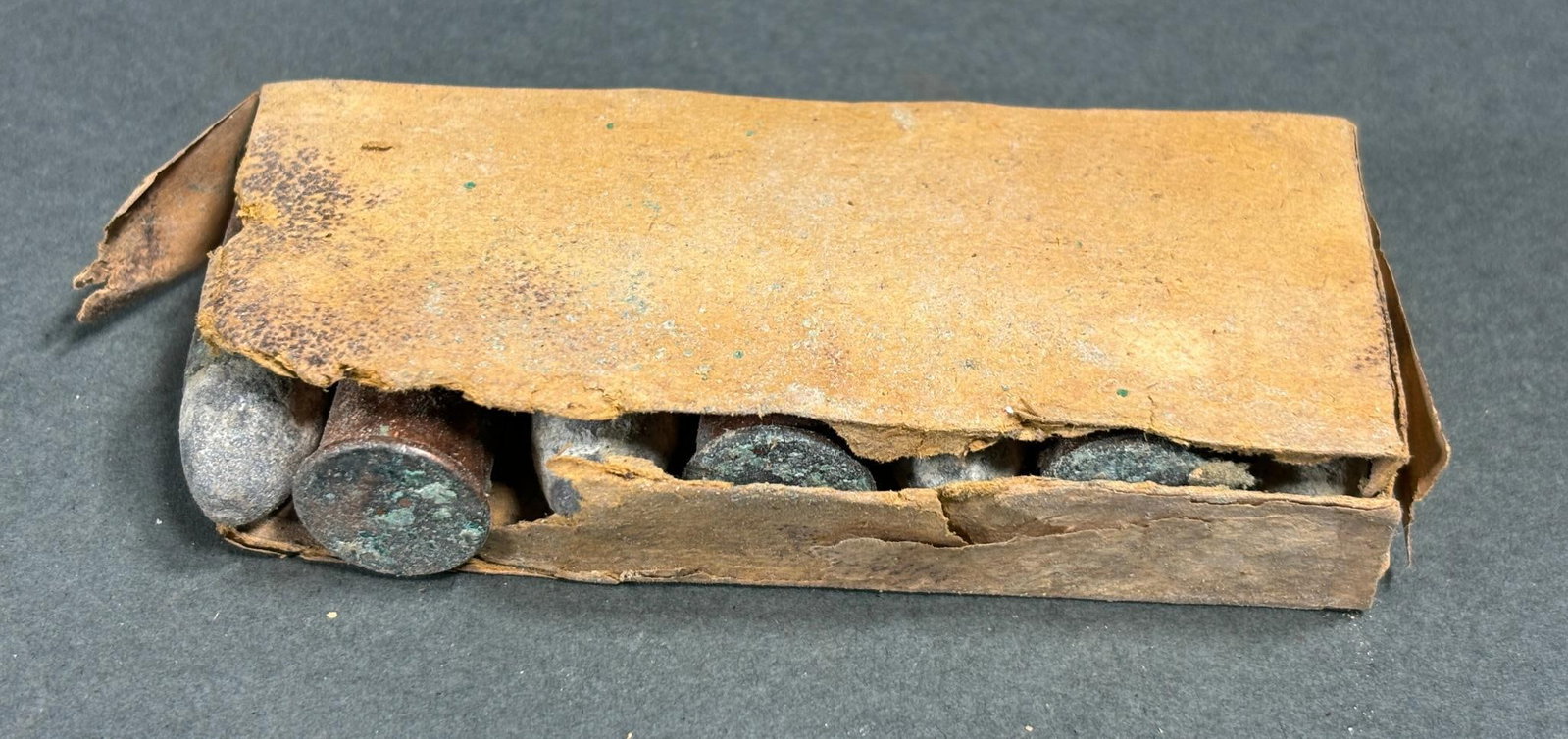 CIVIL WAR SPENCER 56-50 CARTRIDGES PACK OF 7: 7 Civil War Spencer carbine - rifle .56 - .50 cartridges still in the original pack. The package is partially open but complete and retains a fragment of the original label. In-house shipping is avail
