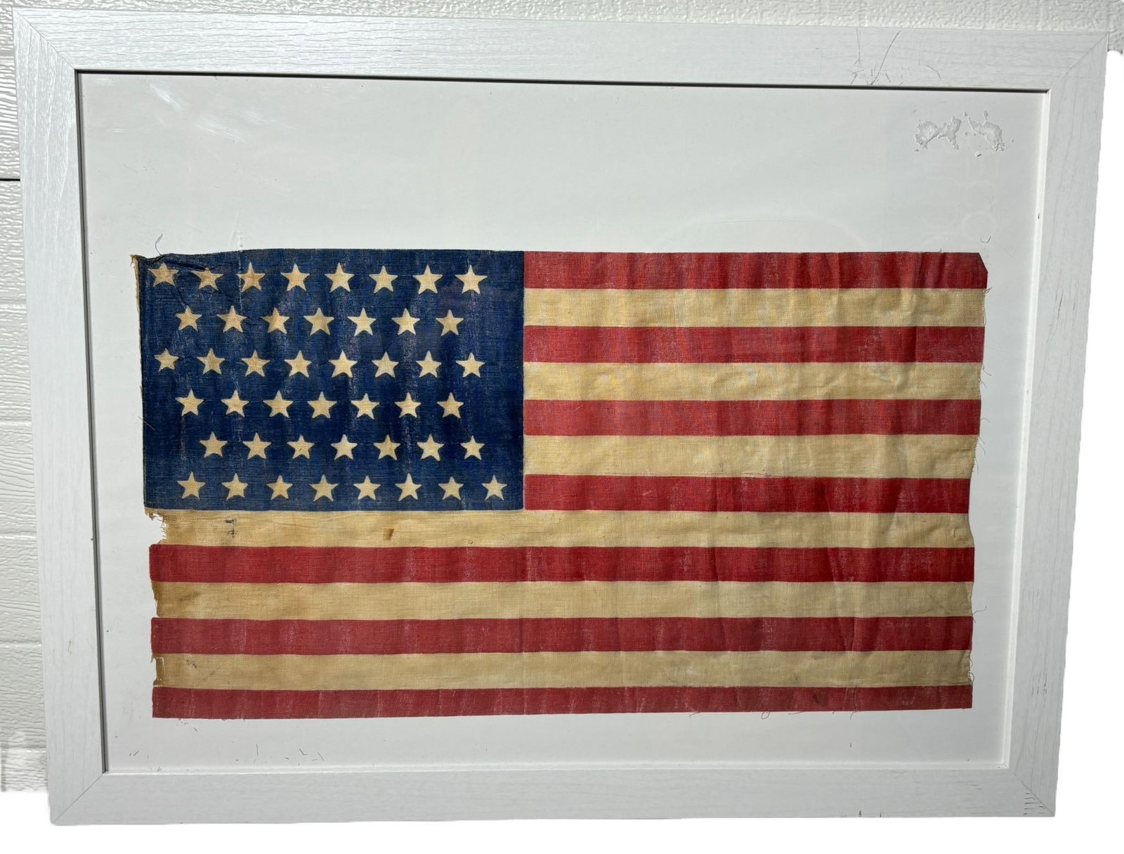 SPANISH AMERICAN WAR 45 STAR PARADE FLAG: Spanish American War era original 45 star flag printed on muslin. Colors are still vibrant and the flag is in overall very good condition. There is some damage on the hoist end, most likely occurring 