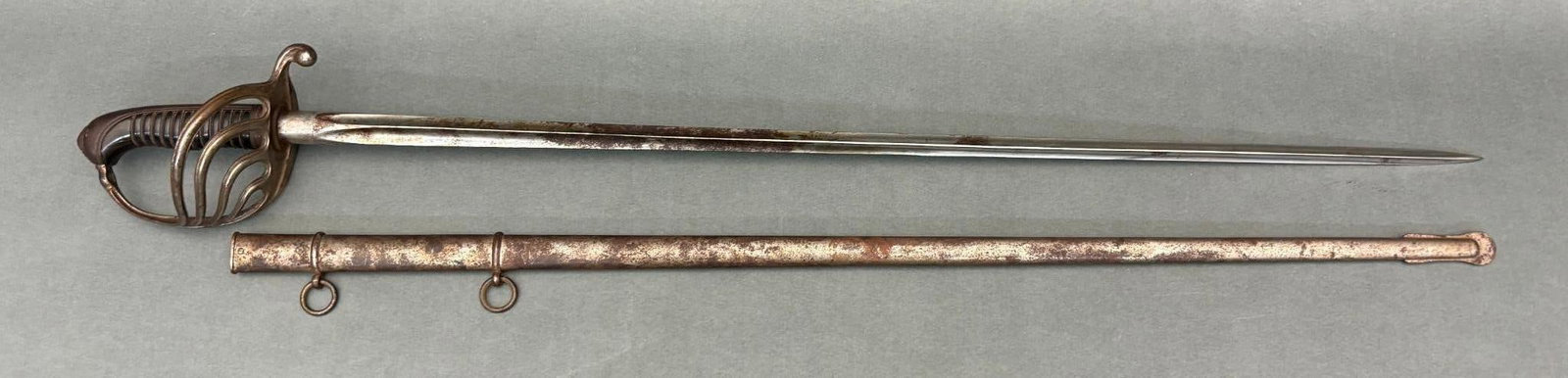M1882 FRENCH SWORD WITH PREVAL TRIANGULAR BLADE: Model 1882 French Sword with Preval Blade - 32.5" blade length, 37.75" overall length. Bright blade with patches of patinated surface rust. Metal guard with wire wrapped grips. Triangular cross sectio