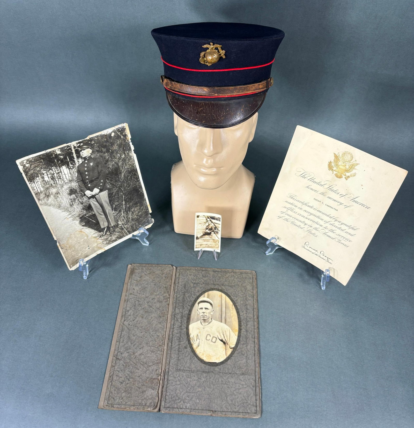 POST WWI USMC IDED GROUP INCL. MARINE P 1912 CAP: Post World War One grouping identified to Edgar A. Carpenter, United States Marine Corps. The centerpiece of this group is his 1912 pattern bell crown dress blue cap which is accompanied by two photog