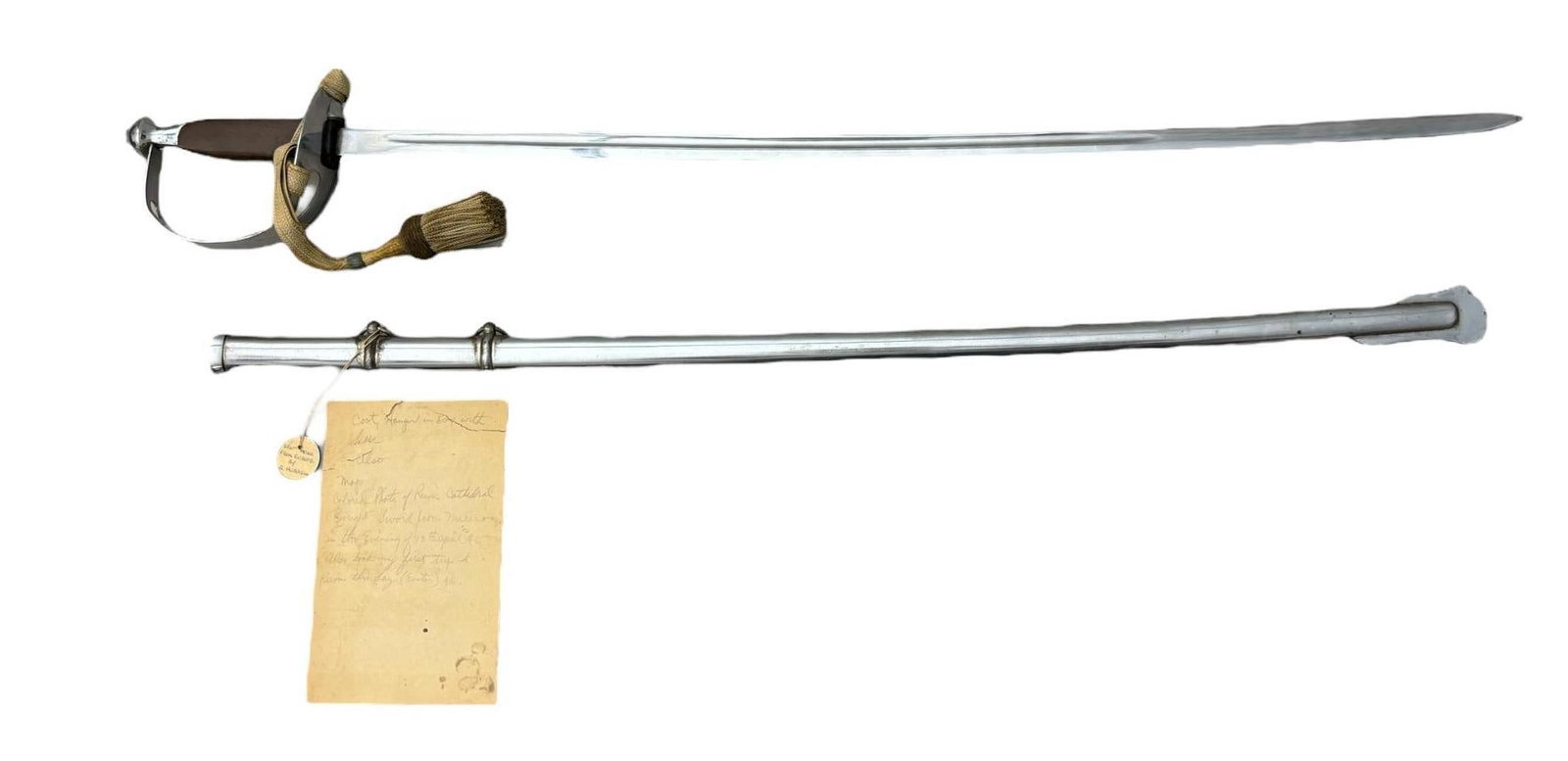 WWII AUSTRIAN SWORD & KNOT VETERAN BRING BACK: World War Two veteran bring back lot featuring an Austrian sword with scabbard and original sword knot. This sword, along with four other items in this auction, was brought back by veteran Roger Hubbe