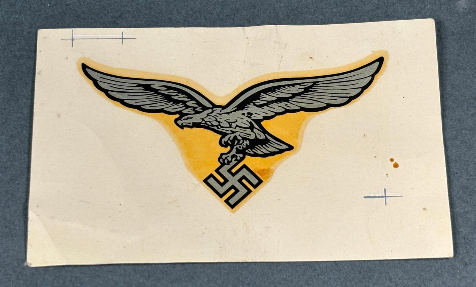 WWII NAZI GERMAN LUFTWAFFE UNUSED HELMET DECAL: Original World War Two water transfer Luftwaffe decal. The eagle decal measures approx. 38mm x 70mm and the total measurement including the paper background is 57mm x 89mm. In-house shipping is availa