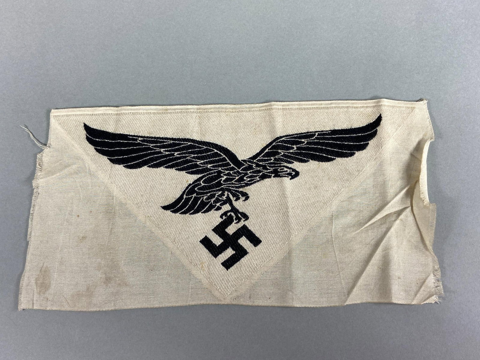 WWII NAZI GERMAN LUFTWAFFE SPORTS SHIRT EAGLE: World War Two large sized (11.5" x 6") Luftwaffe Sports shirt eagle. Bevo embroidery. Unissued and unworn. A few light stains. In-house shipping is available. Pickup is Monday, April 29th from 11 am t