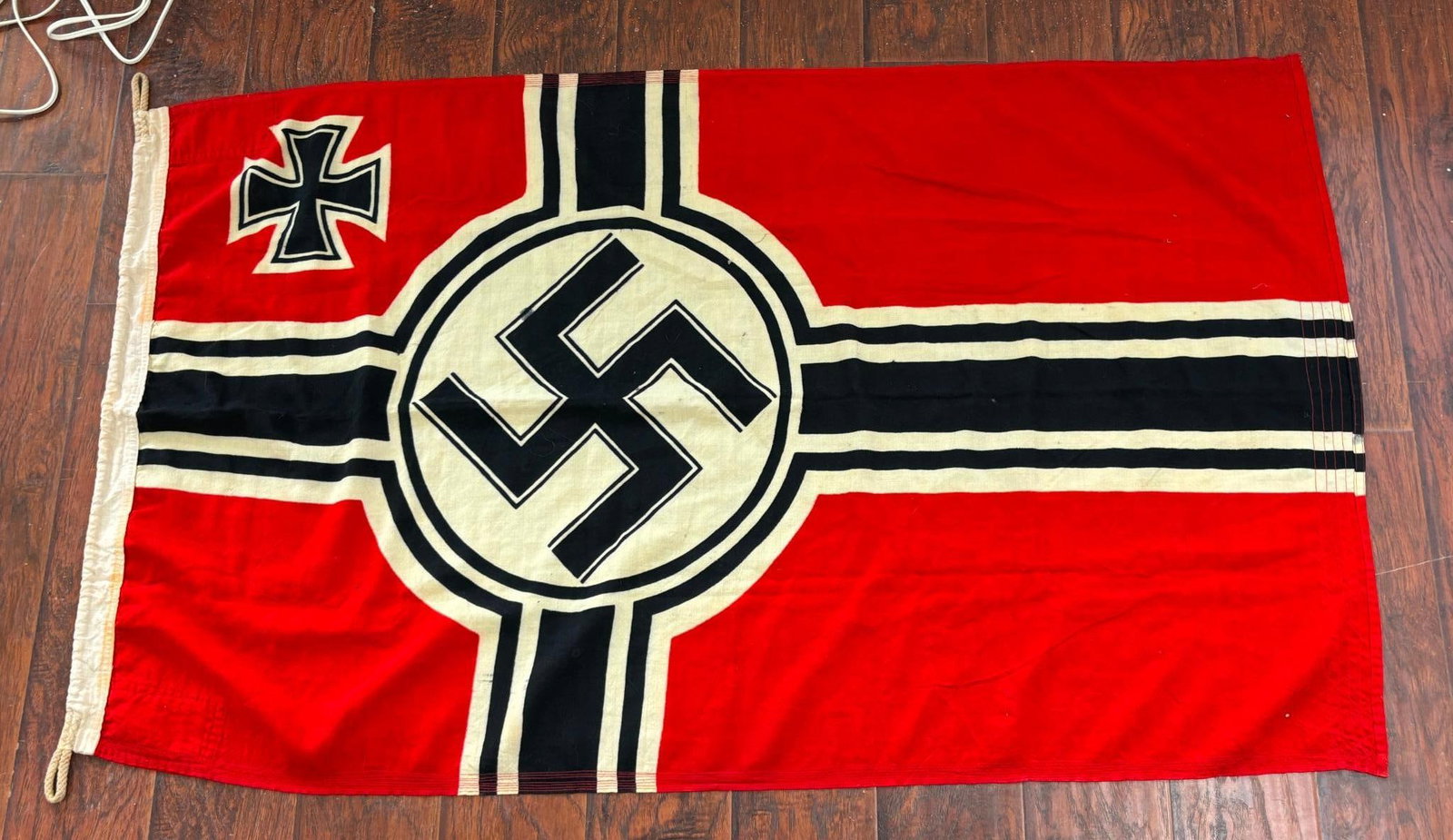 WWII NAZI GERMAN KRIEGSMARINE FLAG - WOOL: World War Two Nazi German wool Kriegsmarine - Navy flag. The hoist bears waffenamt markings and "Reichskriegsflg.1,0 x 1,7 Berliner Fahnenfabrik Geitel & Co. Berlin ". The hoist corners are reinforced