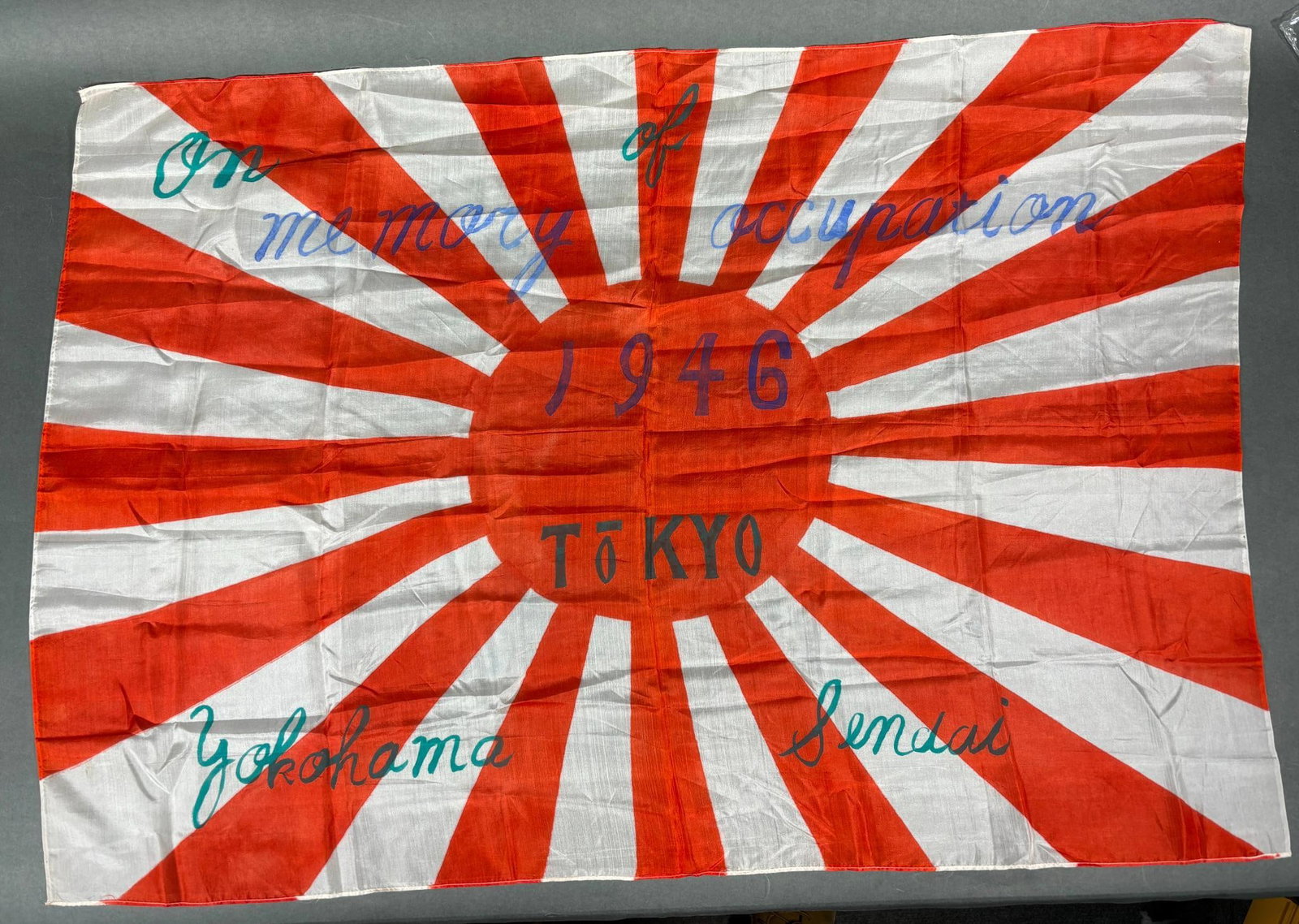 WWII JAPANESE RISING SUN FLAG OCCUPATION SOUVENIR: World,War Two Japanese Rising Sun Army flag identified as a 1946 occupation souvenir listing Tokyo, Yokohama, and Sendai. Excellent condition.In-house shipping is available. Pickup is Monday, April 29