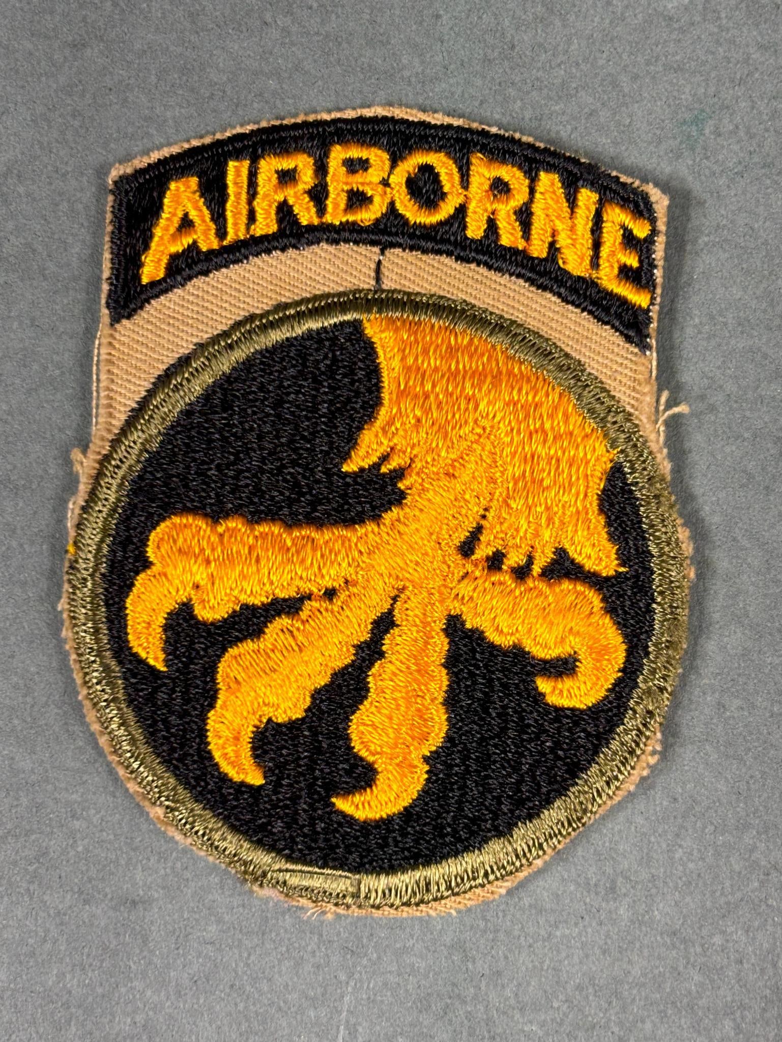 WWII U.S 17TH AIRBORNE REVERSE TALON PATCH & TAB: World War Two 17th Airborne Division reversed talon patch and attached tab. Does not glow under UV light. In-house shipping is available. Pickup is Monday, April 29th from 11 am to 3 pm in Carroll, Oh
