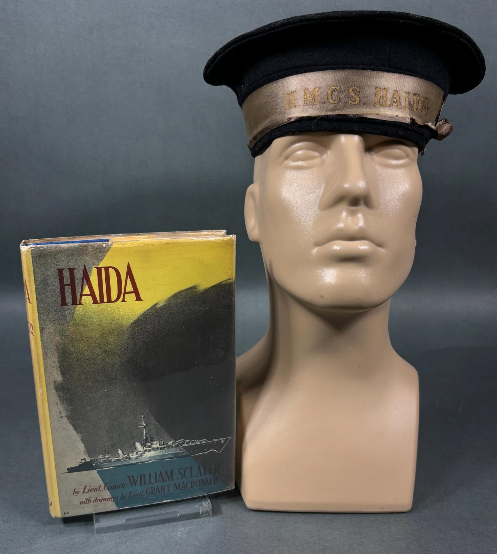 WWII ROYAL CANADIAN NAVY RATINGS CAP HCMS HAIDA & 1ST EDITION BOOK "HAIDA" PUBLISHED 1946: World War Two Royal Canadian Navy ratings (enlisted sailor) wool cap with a post war H.C.M.S. Haida silk tally. The underside of the cap is manufacturer stamped NATIONAL HAT MFG. CO. 1945 71/4. Cap is