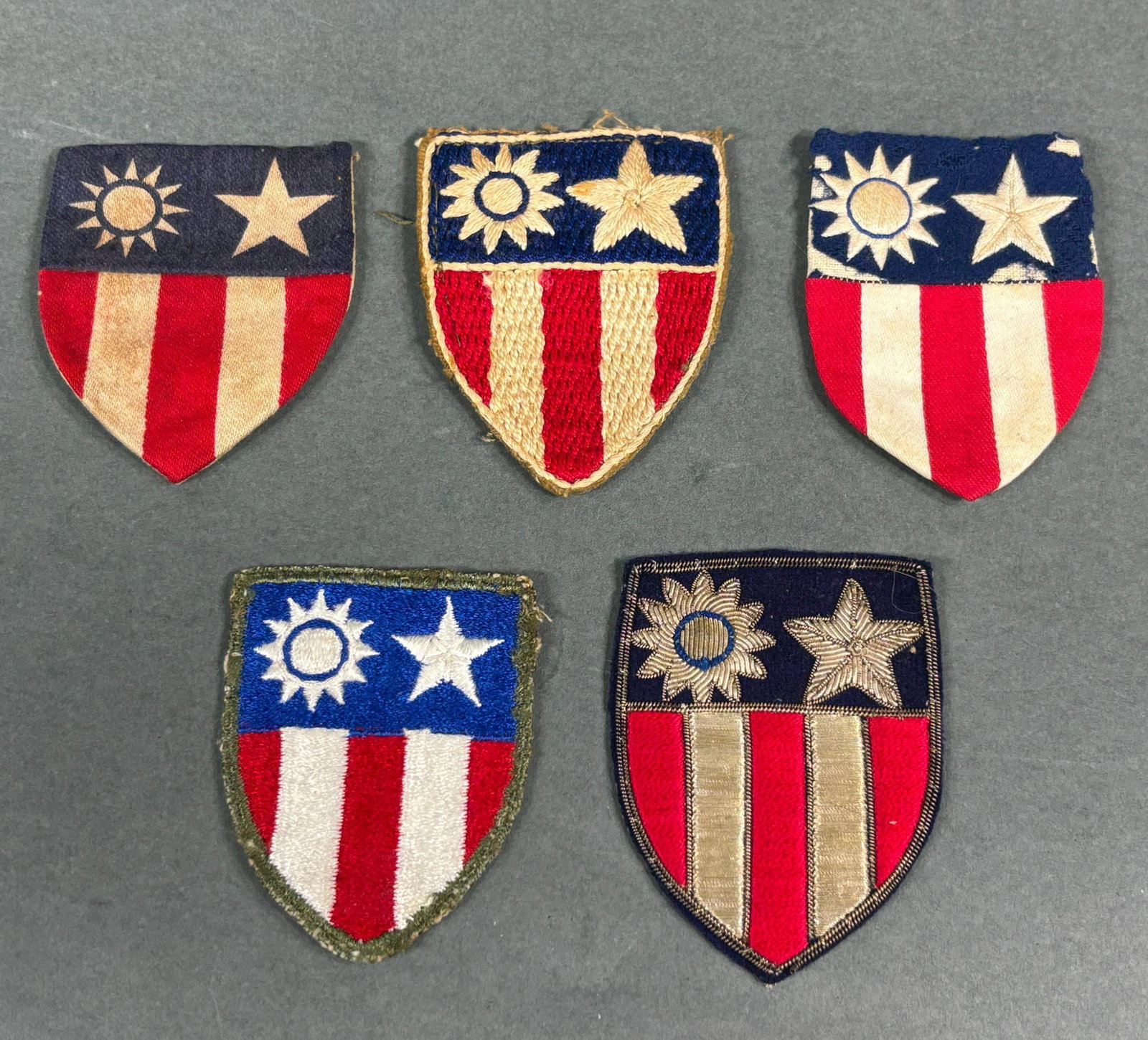 WWII CBI CHINA BURMA INDIA PATCH LOT THEATER MADE: World War Two lot of five CBI patches including 4 theater made and an OD border patch that was American made. Nice variety including bullion, ribbed weave, cotton & cotton/wool. In-house shipping is a