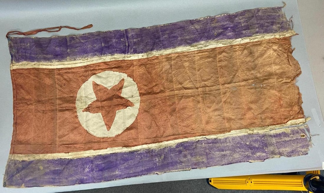 KOREAN WAR NORTH KOREAN FLAG MULTI PIECE CONST.: Rare Korean War multi piece construction silk flag. Veteran bring back. This flag was constructed from 7 separate pieces of material. The red field had a circular section cut out to accommodate the wh
