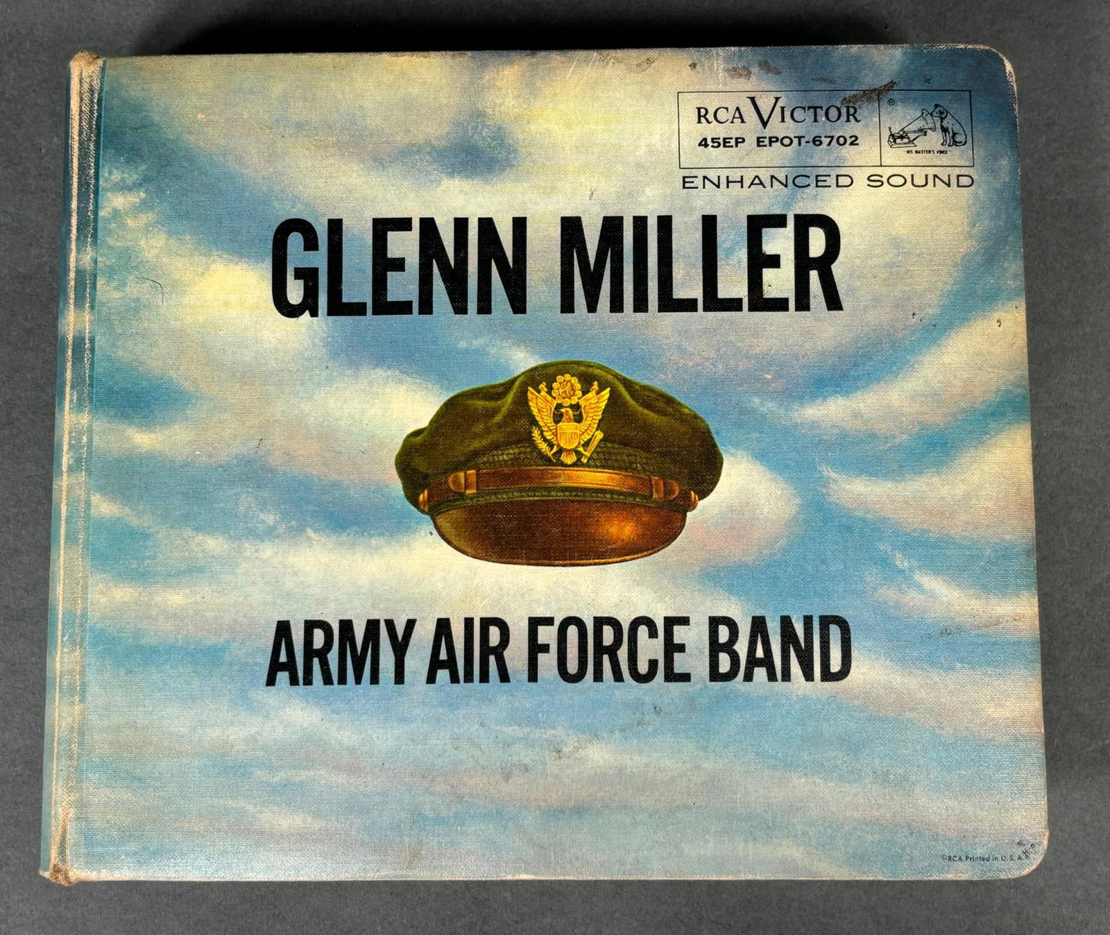 WWII GLENN MILLER ARMY AF BAND 45RPM RECORD SET 15: World War Two Glenn Miller Army Air Force Band 15 record set of 45rpm records housed in a "comb" binder with a 18 page booklet. There are a total of 60 songs. Records appear to be in overall fine - ve