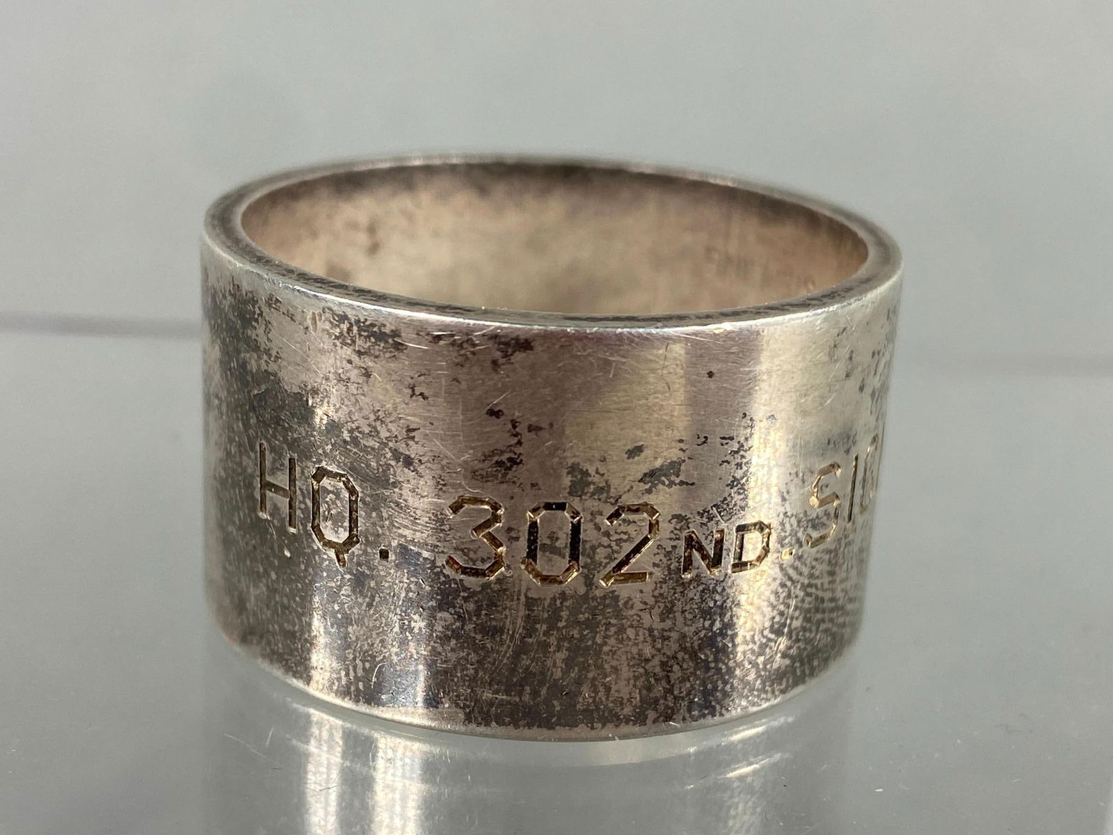 WORLD WAR TWO 302ND SIGNAL BATTALION NAPKIN RING STERLING SILVER: World War Two sterling silver napkin ring engraved HQ 302ND SIGNAL OPERATIONS BN. Originally known as the 302nd Signal Battalion, it was redesignated the 302nd Signal Operation Battalion on 12/8/1942
