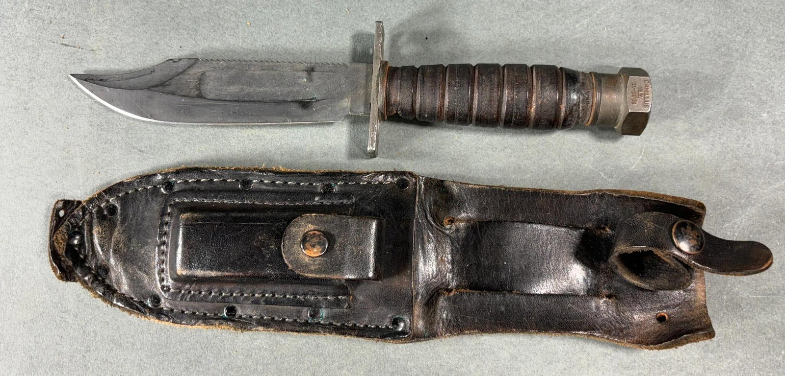 AIR FORCE PILOT SURVIVAL KNIFE CAMILLUS 11-1981: United States Air Force Camillus N.Y pilot survival knife with sheath and sharpening stone. Pommel is stamped Camillus N.Y. 11-1981. In-house shipping is available. Pickup is Monday, April 29th from 1