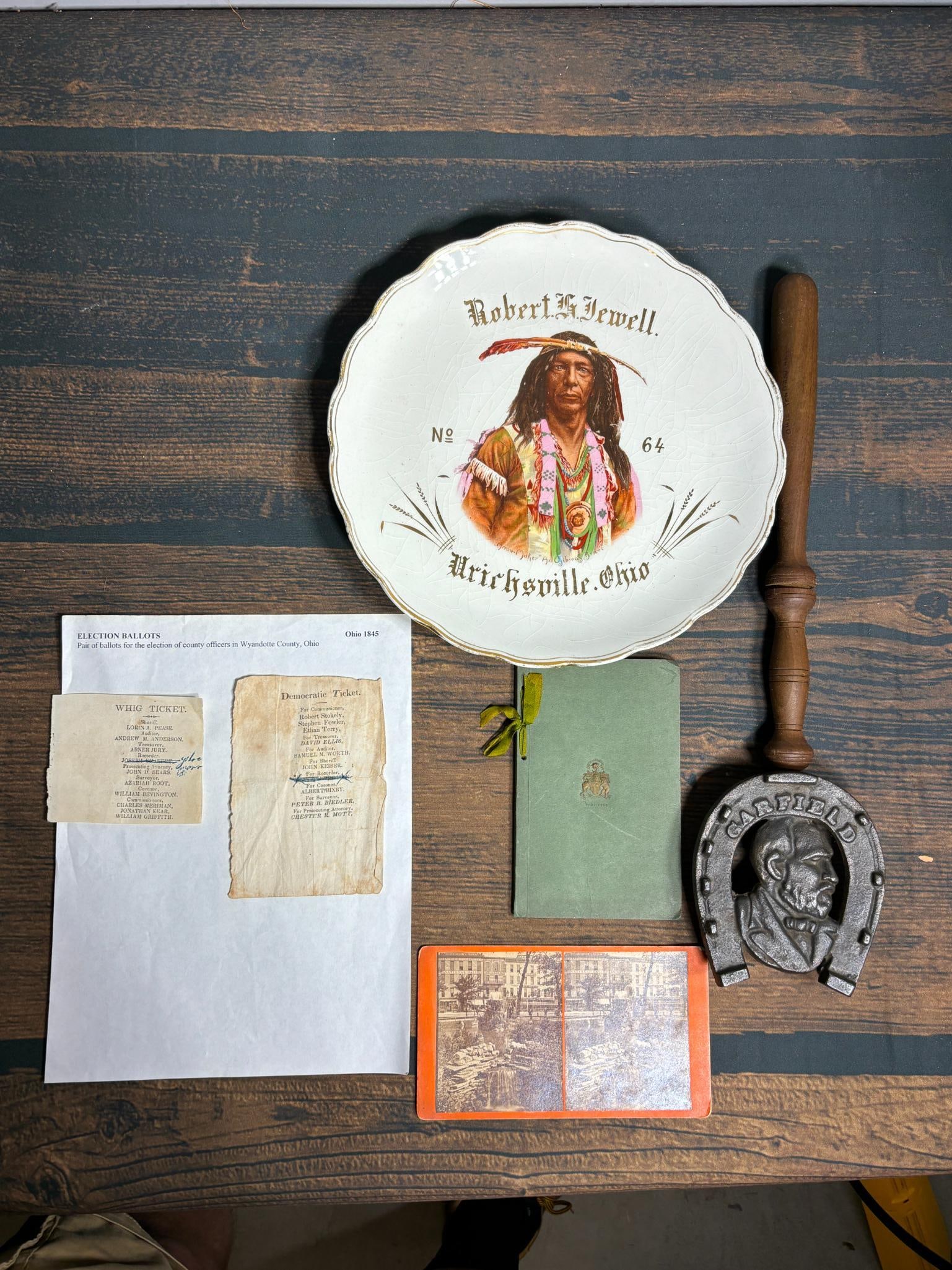 Group of Historical Ohio Related Items Including Political: Wyandotte County Whig ticket election ballots from 1845, Cleveland Stereoview, Toledo Inverness Club bylaws, Garfield trivet, Order of the Red Man Plate, Souvenir billy club from the Ohio Penitentiary