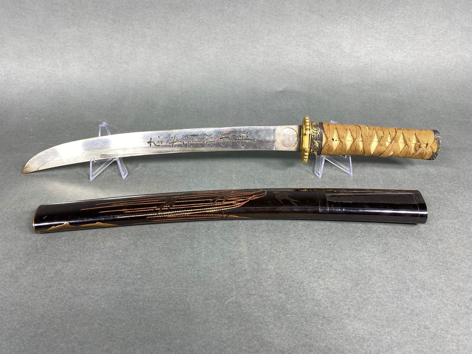 Chinese Samurai Style Sword in Japanese Fittings: The fittings look good, handle, fuchi and kashira and saya. The blade and Tsuba appear old, but Chinese. Interesting piece! 20.25" overall length. In-house shipping is available. Pickup is Tuesday, Ju