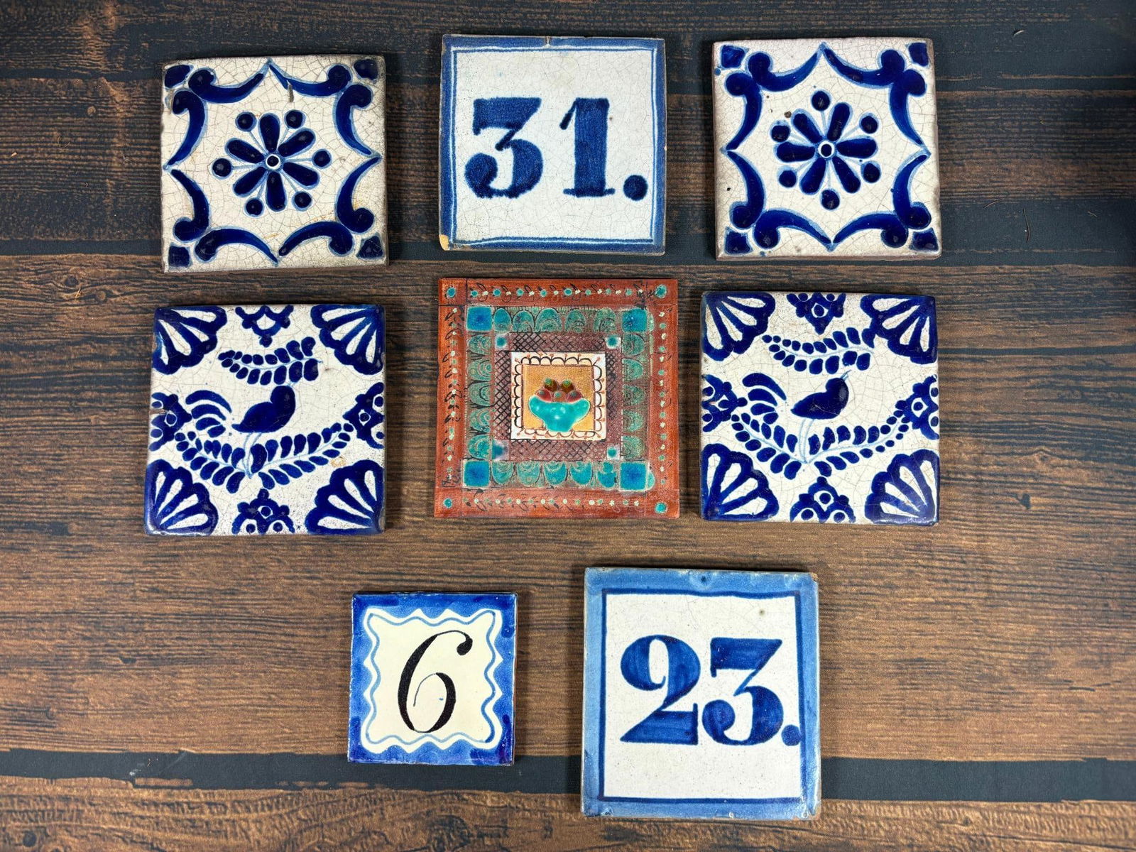 Group Lot of 8 Antique Tiles Including Numbers: Largest is 5.5" x 5.5" In-house shipping is available. Pickup is Tuesday, June 4th from 1 pm to 7 pm and Wednesday, June 5 from 11 am to 3 pm at our offices in Carroll, OH 43112 or we will provide in-