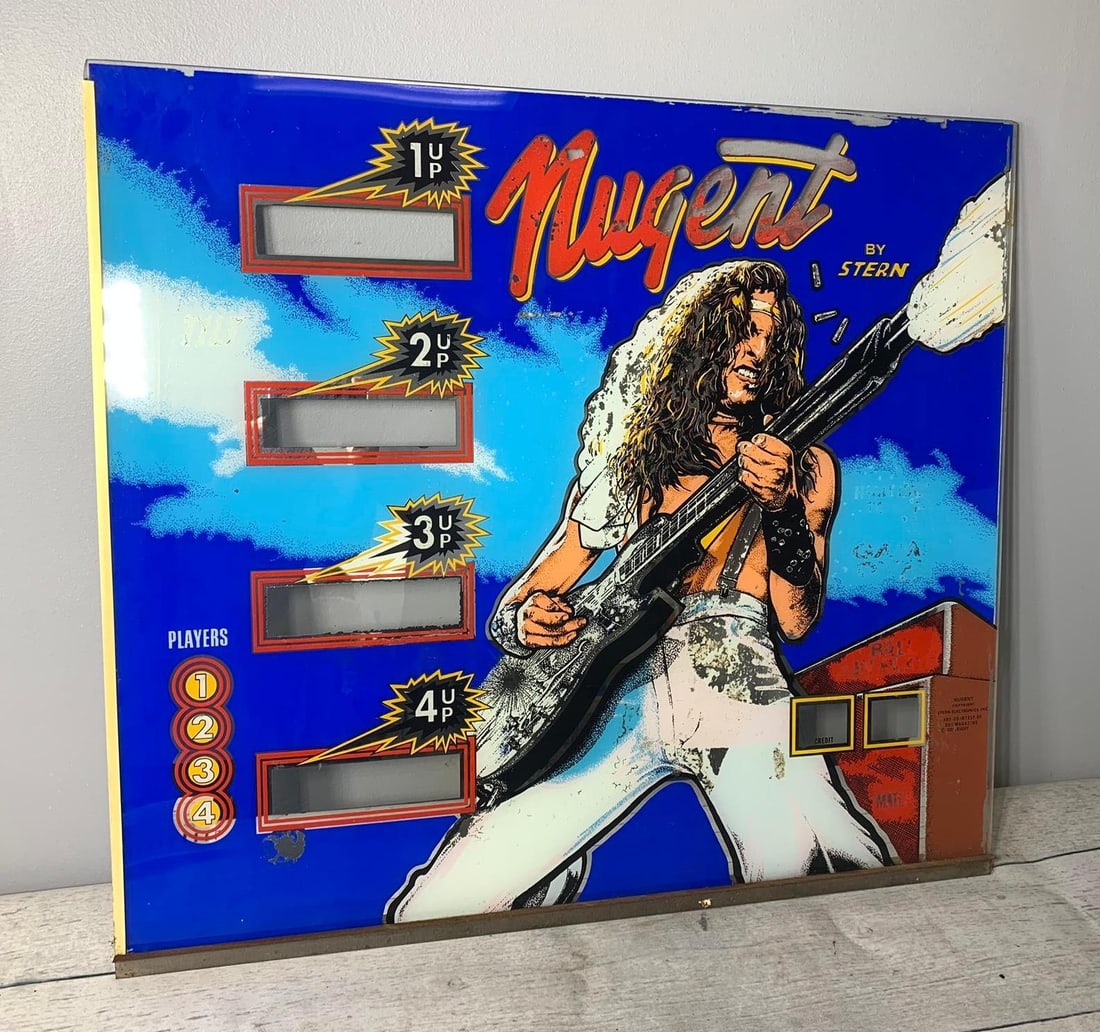 Vintage Stern Ted Nugent Pinball Back Glass: Color flaking off off inside as shown in photos. In-house shipping is available. Pickup is Tuesday, June 4th from 1 pm to 7 pm and Wednesday, June 5 from 11 am to 3 pm at our offices in Carroll, OH 43