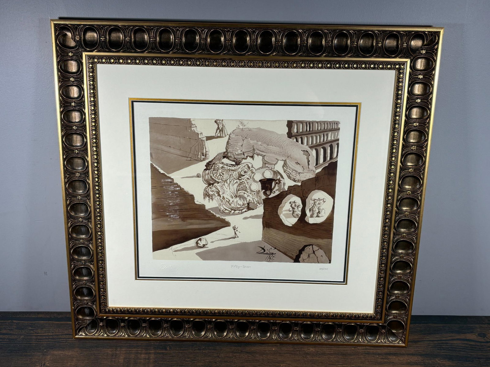Salvador Dali Print Fifty-Seven Destino Disney Edition: 34" x 31" framed size. In-house shipping is available. Pickup is Friday, August 9th from 11 am to 7 pm at our offices in Carroll, OH 43112 or we will provide in-house shipping for this item. Once pack