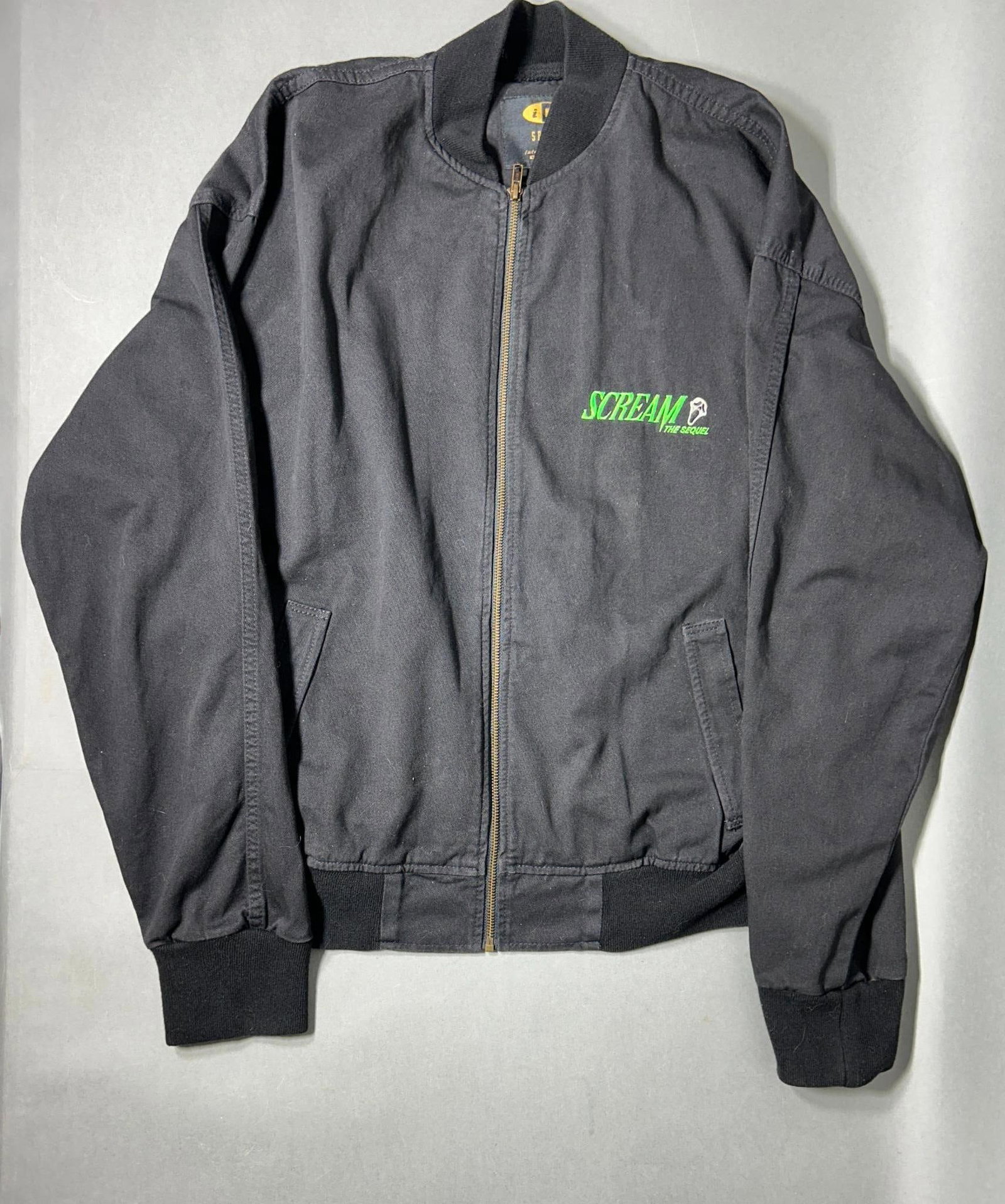 1997 Movie “Scream 2?? (The Sequel) Cast and Crew Black Denim Jacket.: Excellent condition original cast and crew jacket for the 1997 movie "Scream 2" (The Sequel).Jacket is size "Large". There are no rips, tears, holes or stains. Manufacturer's label "ID Sport by Intern