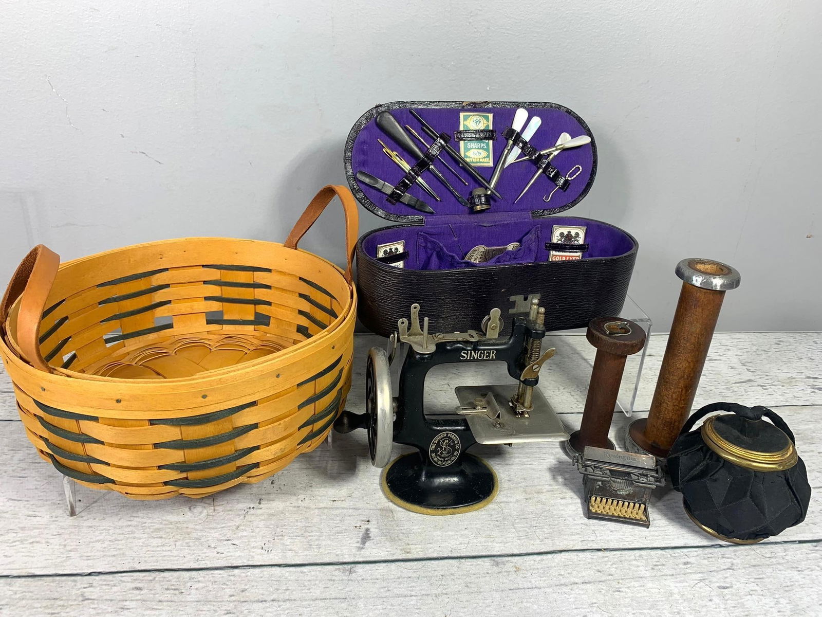 Vintage and Antique Items: Singer Child's Sewing Machine, Sewing Kit, Industrial Yarn Bobbins: And More. In-house shipping is available. Pickup is Friday, August 9th from 11 am to 7 pm at our offices in Carroll, OH 43112 or we will provide in-house shipping for this item. Once packed up we will