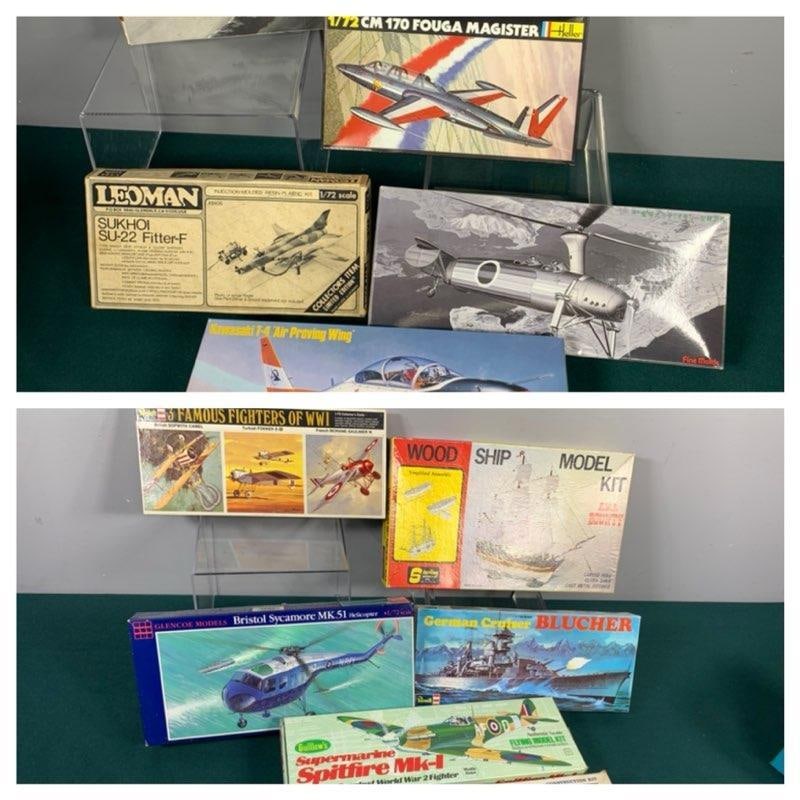 Group of Vintage Warbird Airplane Plastic and Balsa Model Kits and German Cruiser Ship Model Kit: Consignor indicates open boxes are complete unless otherwise noted on box. Cruiser and Famous Fighters of WWI are sealed. In-house shipping is available. Pickup is Friday, August 9th from 11 am to 7 p