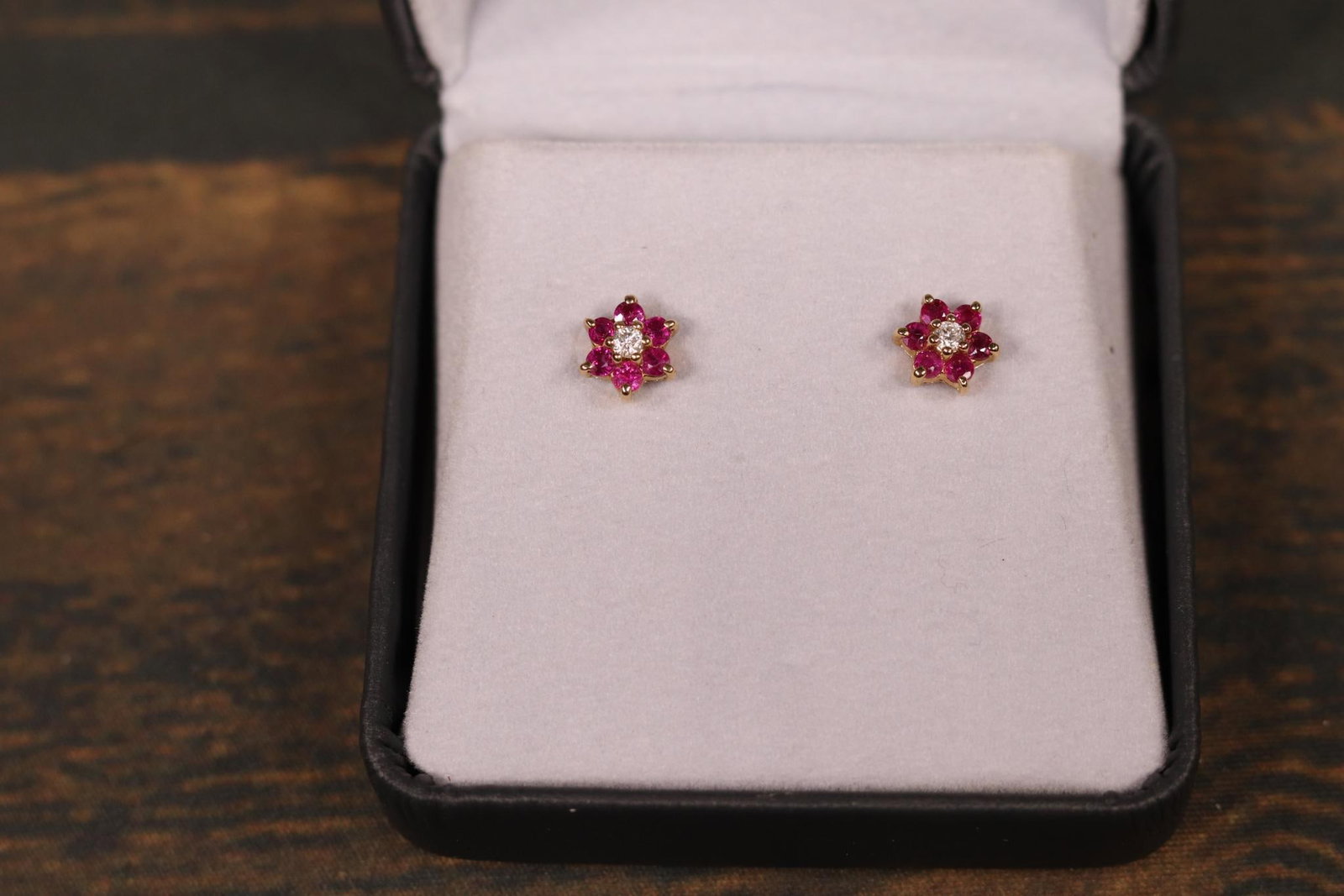 14k Gold Ruby, Diamond Earrings Stars Helzberg: Diamonds I1. Earrings weigh 1.78 grams. Each earring is 8 mm across. In-house shipping is available. Pickup is Friday, August 9th from 11 am to 7 pm at our offices in Carroll, OH 43112 or we will prov
