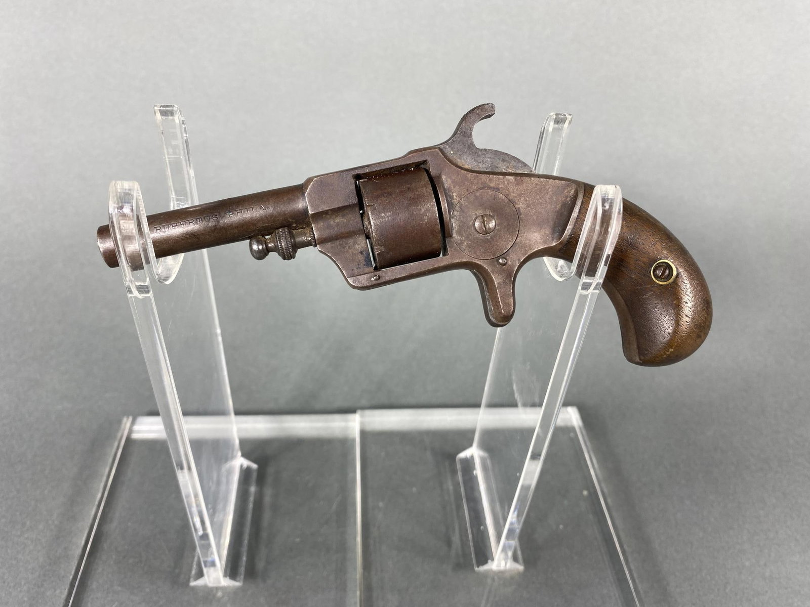 Cira 1871 J. Rupertus Empire Model 22 Short Revolver NOFFL: MFG/IMPORTER: J. Rupertus MODEL: Empire SERIAL: 18886 CALIBER/GAUGE: 22 Short CONDITION: Action good. Bore is pitted by rifling is ok. SIZE: 2.75" bbl. In house shipping available. This item was manuf