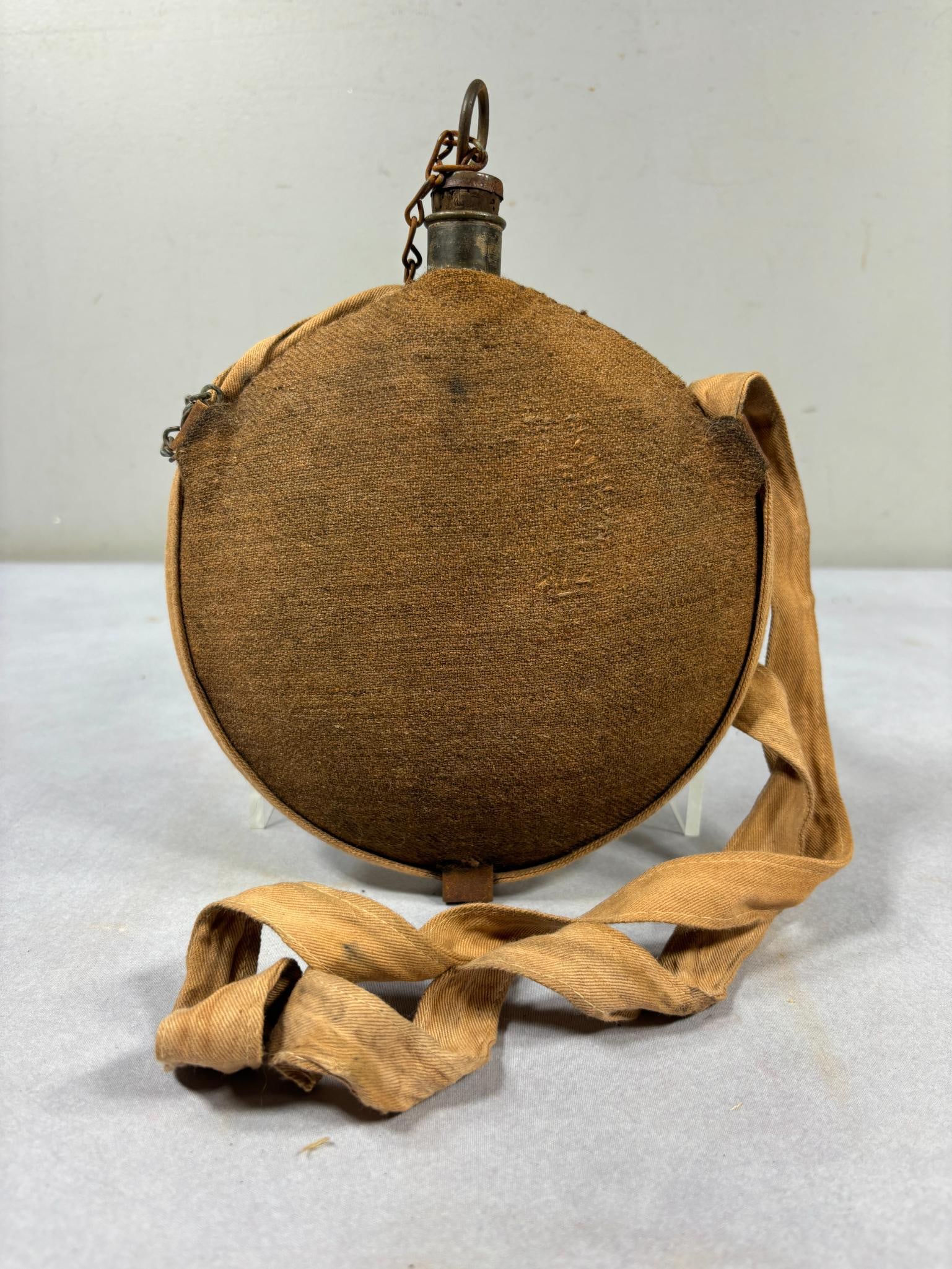 Civil War U.S. Regulation Smoothside Canteen Complete With Stopper & Strap: Civil War Smoothside canteen with brown cover in excellent condition. Does not appear to have ever been issued. The 1" wide strap is complete and intact with only a few small stains There are no dents