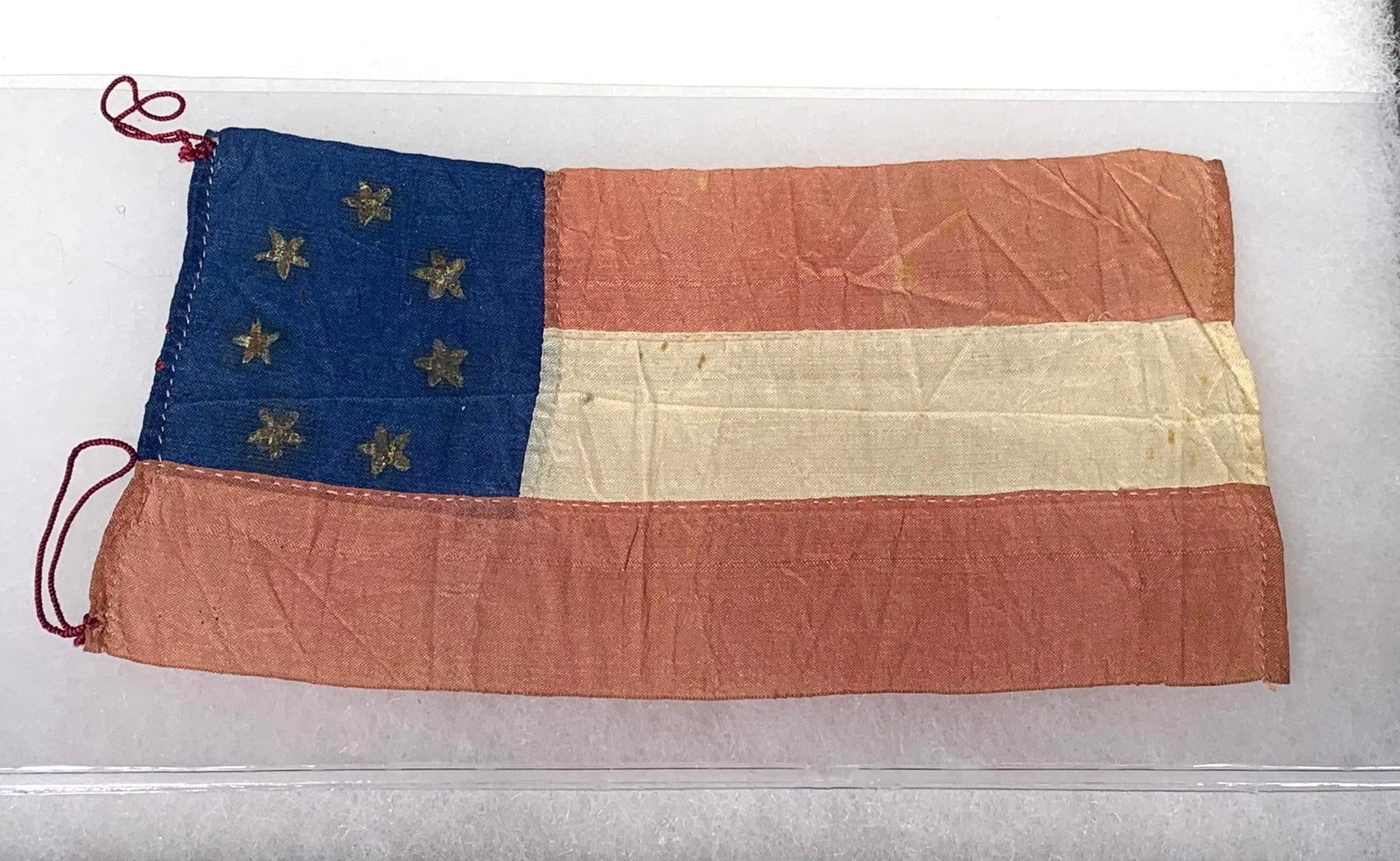 Rare Confederate Bible Flag with Pressed Gold Stars: Update - I was asked to put a blacklighted photo of this flag in the listing, which we have done. Thank you! The flag measures 5" x 2.5". The flag has three broad stripes and a blue field with 7 press