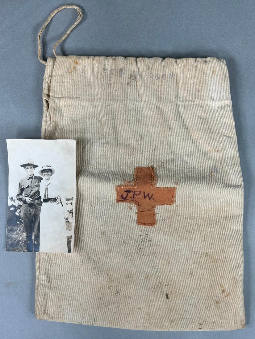 WWI American Red Cross Ditty Bag And Soldier Photograph: World War One American Red Cross "ditty" bag identified across the top to "James P. Watson" and with the initials "J.P.W." written across the applied red cross. Bag measures approximately 9" x 12". Ac