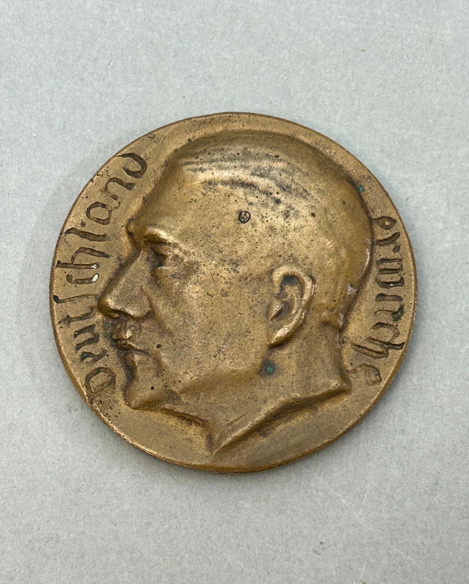 WWII Nazi German "Freheit U Brot !" Table Medal: World War Two Nazi German table medal featuring a bust of Adolf Hitler on the front with the slogan of Deutschland Erwache (create Germany). The reverse features an eagle clutching a wreathed swastika