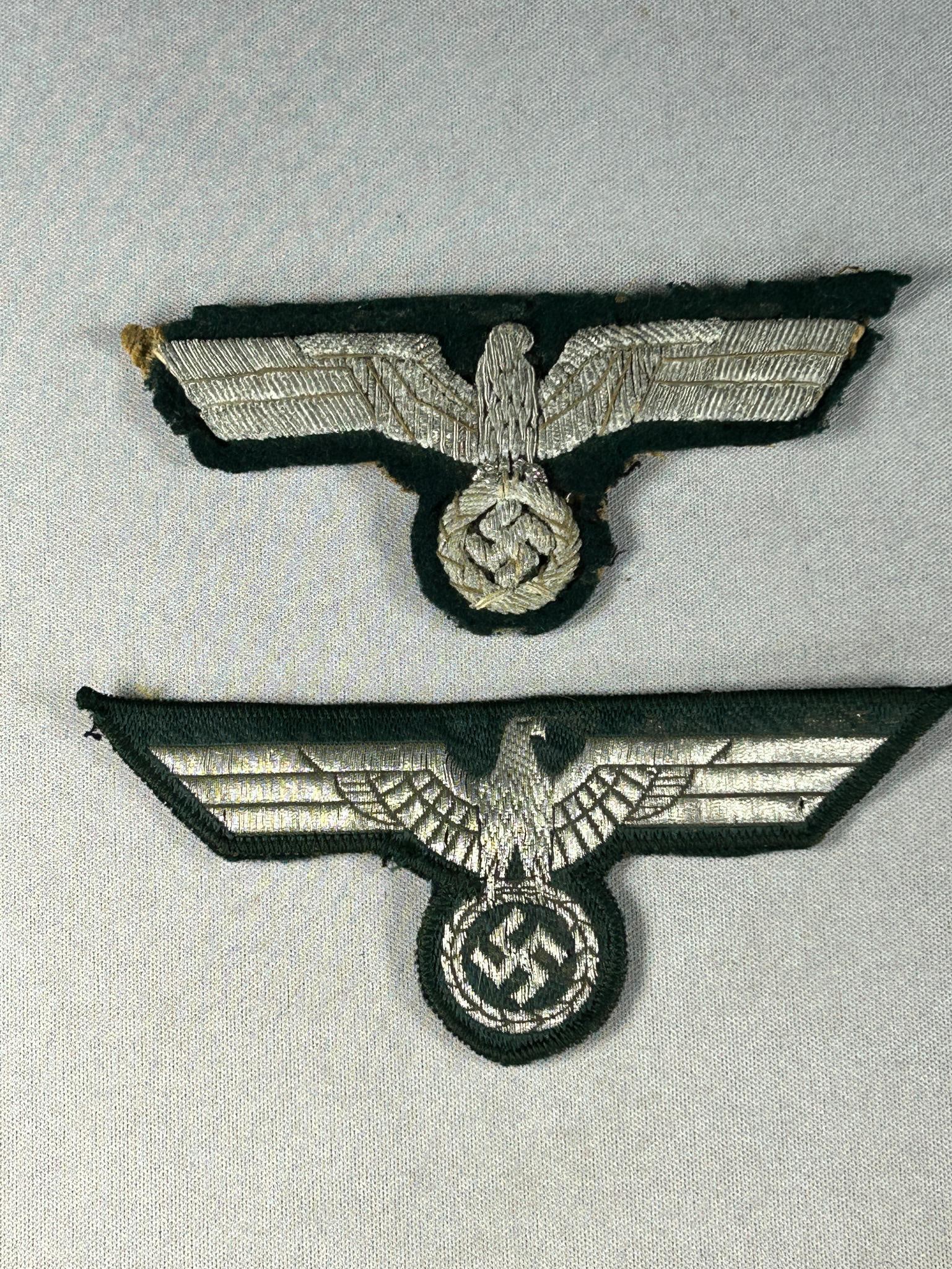 WWII Nazi German Officer Heer Eagle Lot: World War Two Nazi German Heer eagles. The eagle in raised bullion appears to have been removed from a tunic. In-house shipping is available. Open pickup is Tuesday, Oct. 29 from Noon to 7 pm at our o