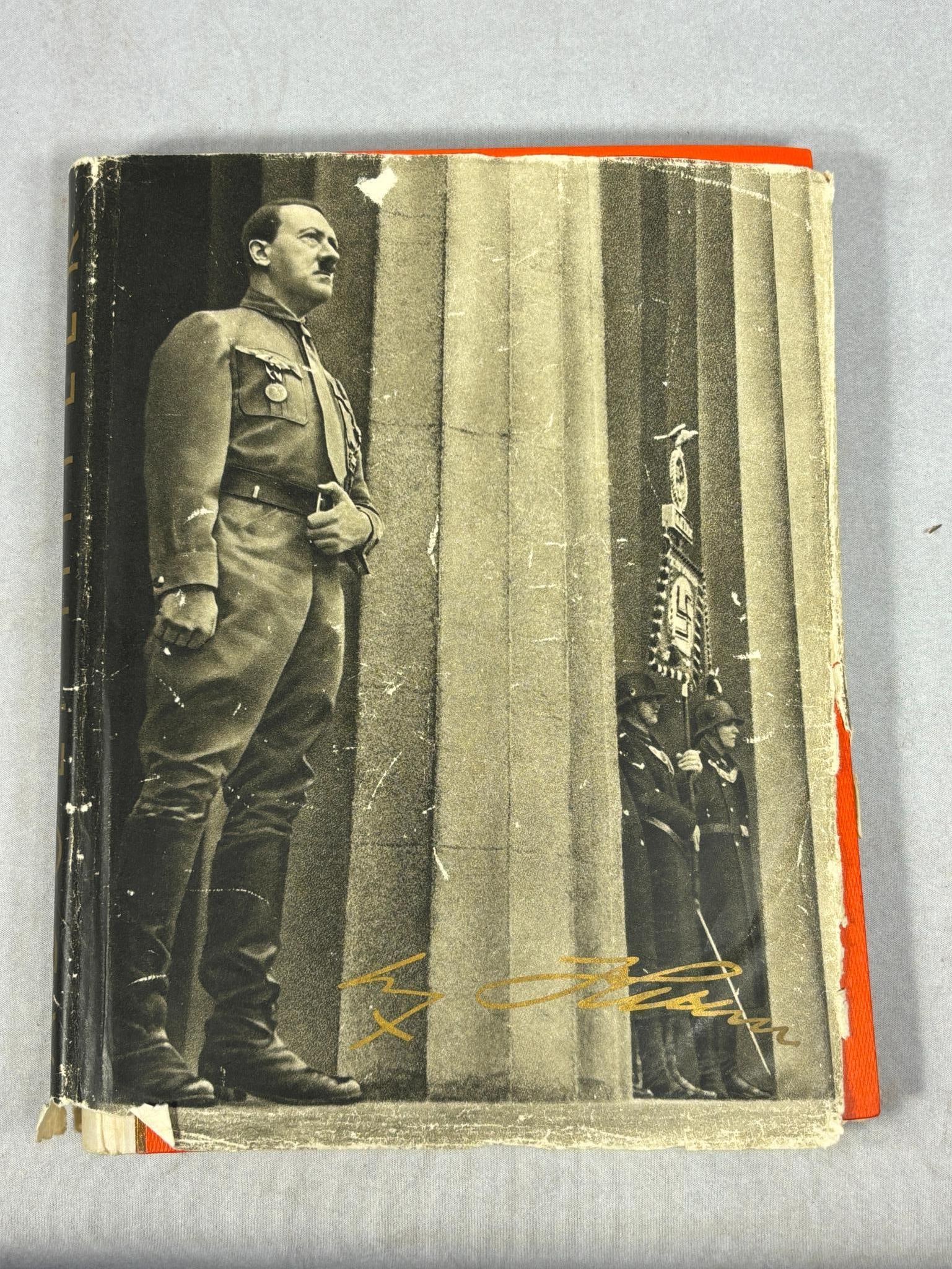 WWII Nazi German Cigarette Card Album Adolf Hitler with Dust Jacket: World War Two German Cigarette Album Titled "Adolf Hitler" with dust jacket. 133 pages, black & white photographs, published 1936 by Cigaretten-Bilderdienst Hamburg - Bahrenfeld. Album features orange