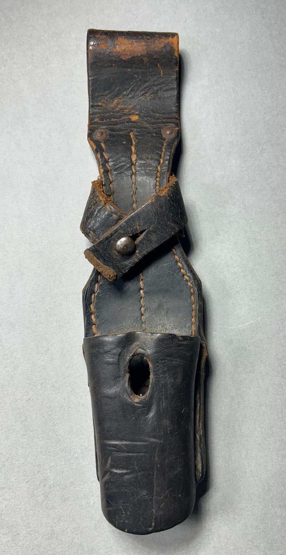 WWII Nazi German K98 Bayonet Frog: World War Two German early 1940 - 1941 K98 bayonet frog. Leather has some wear but is still supple and flexible. In-house shipping is available. Open pickup is Tuesday, Oct. 29 from Noon to 7 pm at ou