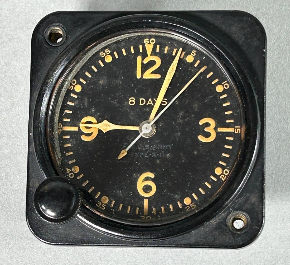 WWII 1943 U.S. Army Air Force Type A-11 8 Day Clock - Elgin: World War Two 1943 United States Army Air Force Type A-11 8 day clock. The dial reads A.C. U.S. Army TYPE A-11. The back plate bears manufacturer information, ORDER No. AC-34898 / MFRS. PART No. 1776