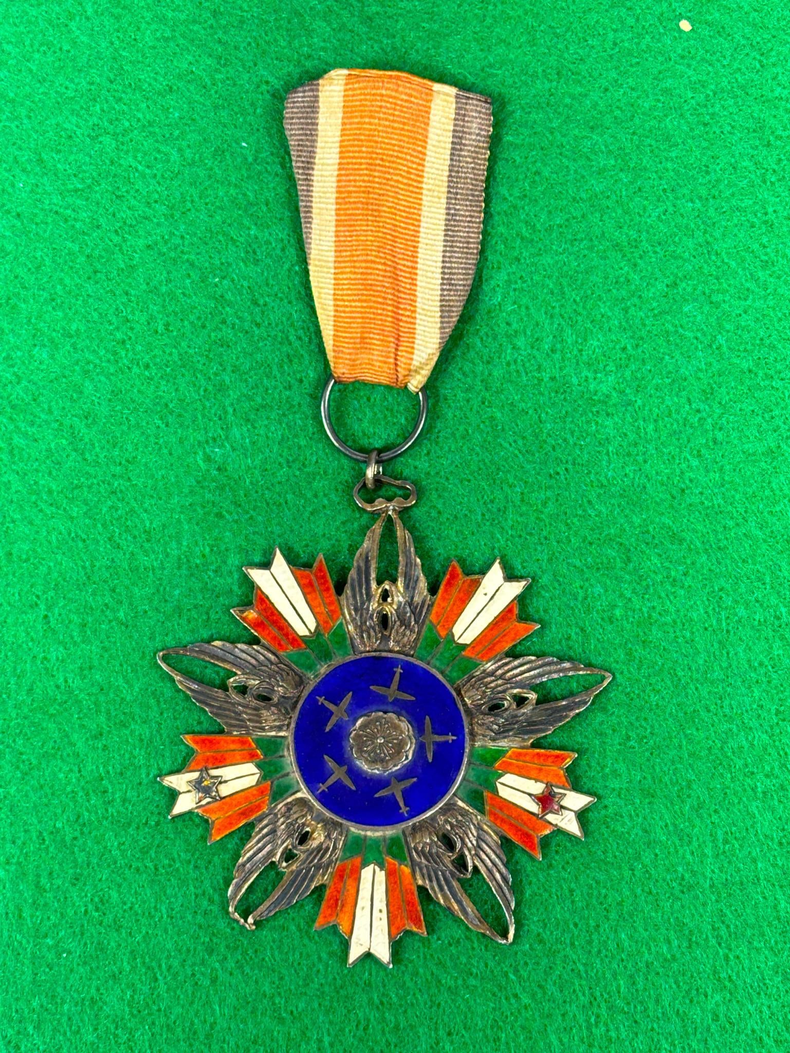 WWII Chinese Air Force Order of Rejuvenation 2nd Class Medal: World War Two Chinese Nationalist Air Force Order of Rejuvenation 2nd Class medal. Instituted in 1937 and was conferred upon members of the Air Force in recognition of 6 to 8 kills, at least 250 missi