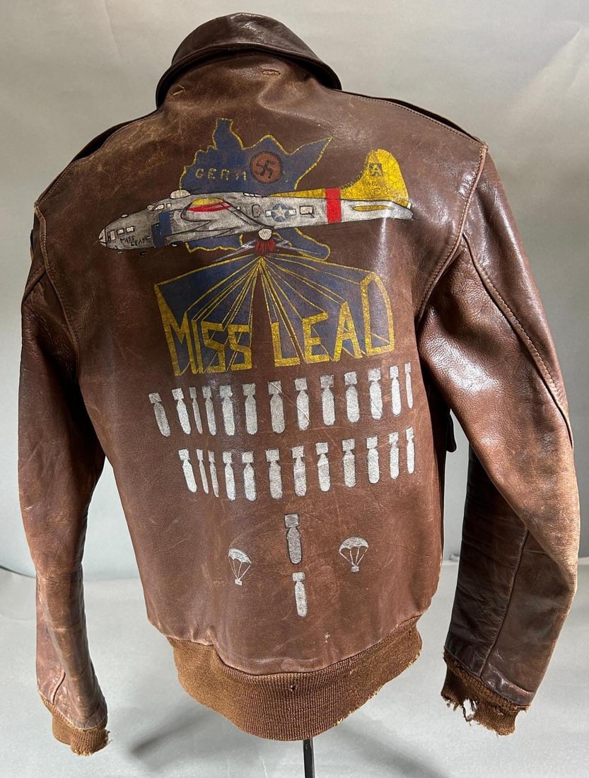 WWII A-2 Jacket "Miss Lead" Painted and Identified 8th Air Force: World War Two A-2 U.S. 8th Army Air Force jacket. The painting on the back features a B-17 bomber flying over a map of Germany. The plane's name "MISS LEAD" is bursting forth from the ball turret and