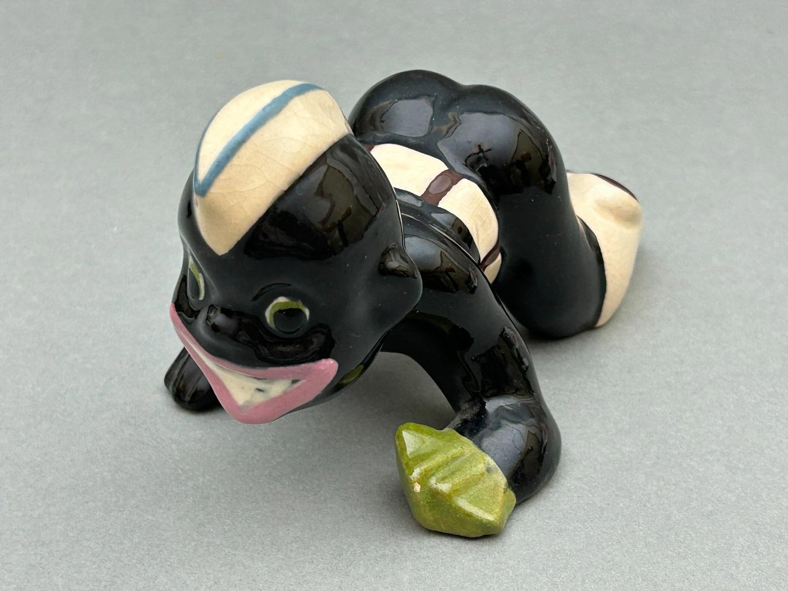 WWII Black Americana - "Little Joe" Dice Player: World War Two era Brayton Laguna pottery figurine of "Little Joe" dice player in U.S. Army uniform. Measures 5.5" long x 3.25" wide x 3.5" tall. Excellent condition. Does not have the mfg. sticker on 