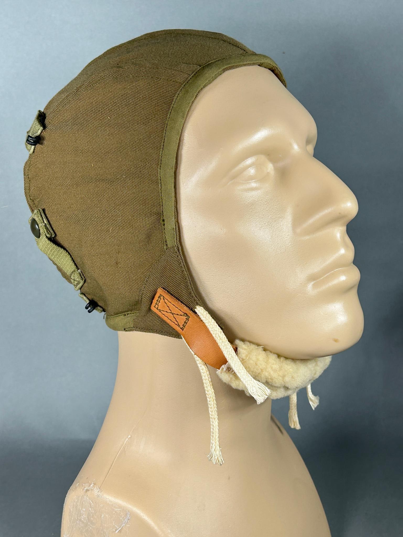WWII U.S. Army Air Force A-9 Summer Flight Helmet: World War Two large size A-9 summer flight helmet. Label is intact. This would be a mint condition helmet but it is missing one of the lamb wool ear pads. In-house shipping is available. Open pickup i