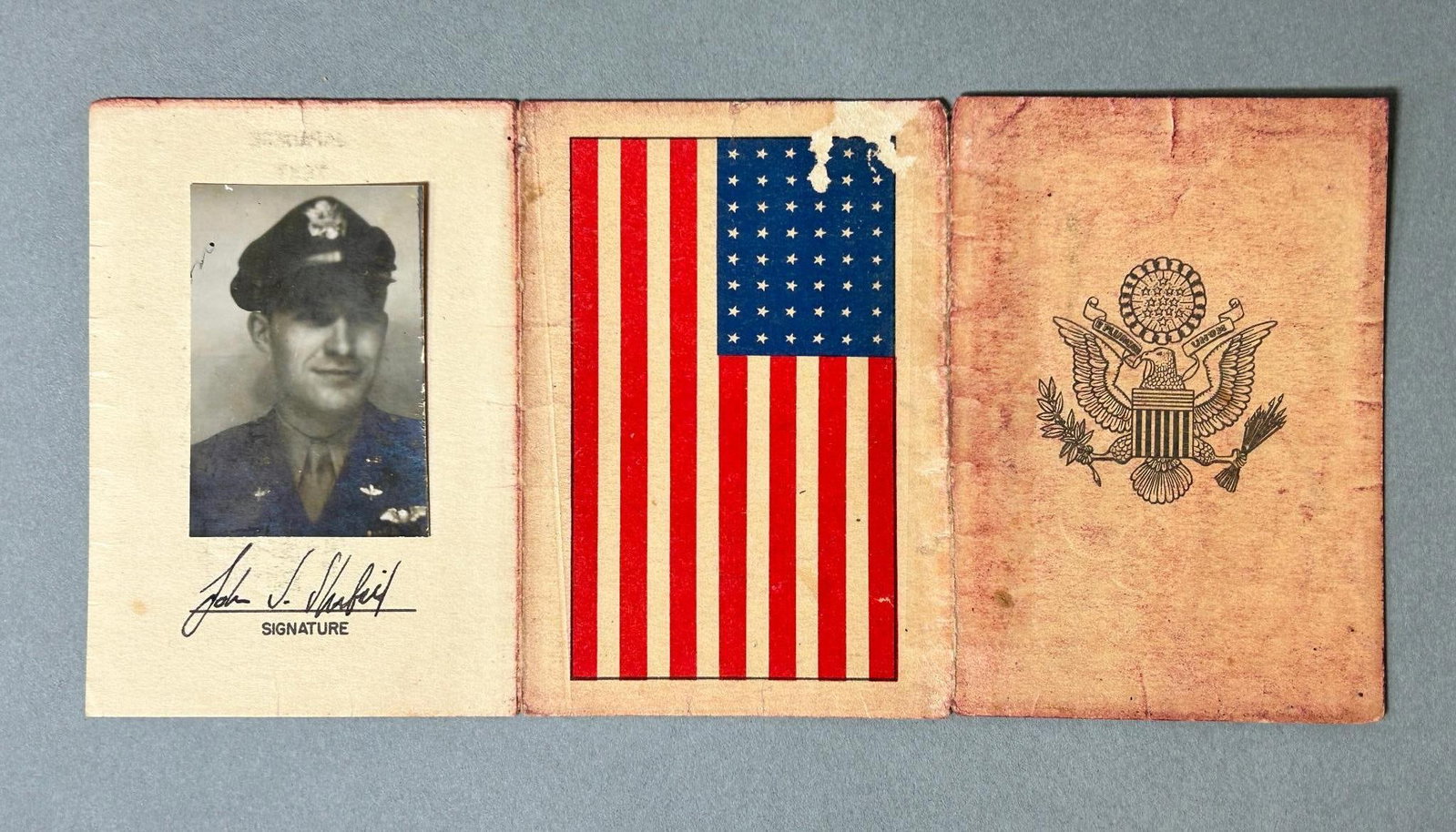 Korean War U.S. Pilot - Aviator Fold Out Paper Blood Chit - Identified: Korean War U.S. Pilot blood chit with the pilot's photograph and signature still intact. This paper fold out blood chit measures 3.625" x 2.5625" when folded and 7.865" x 3.625" when open. The back ha