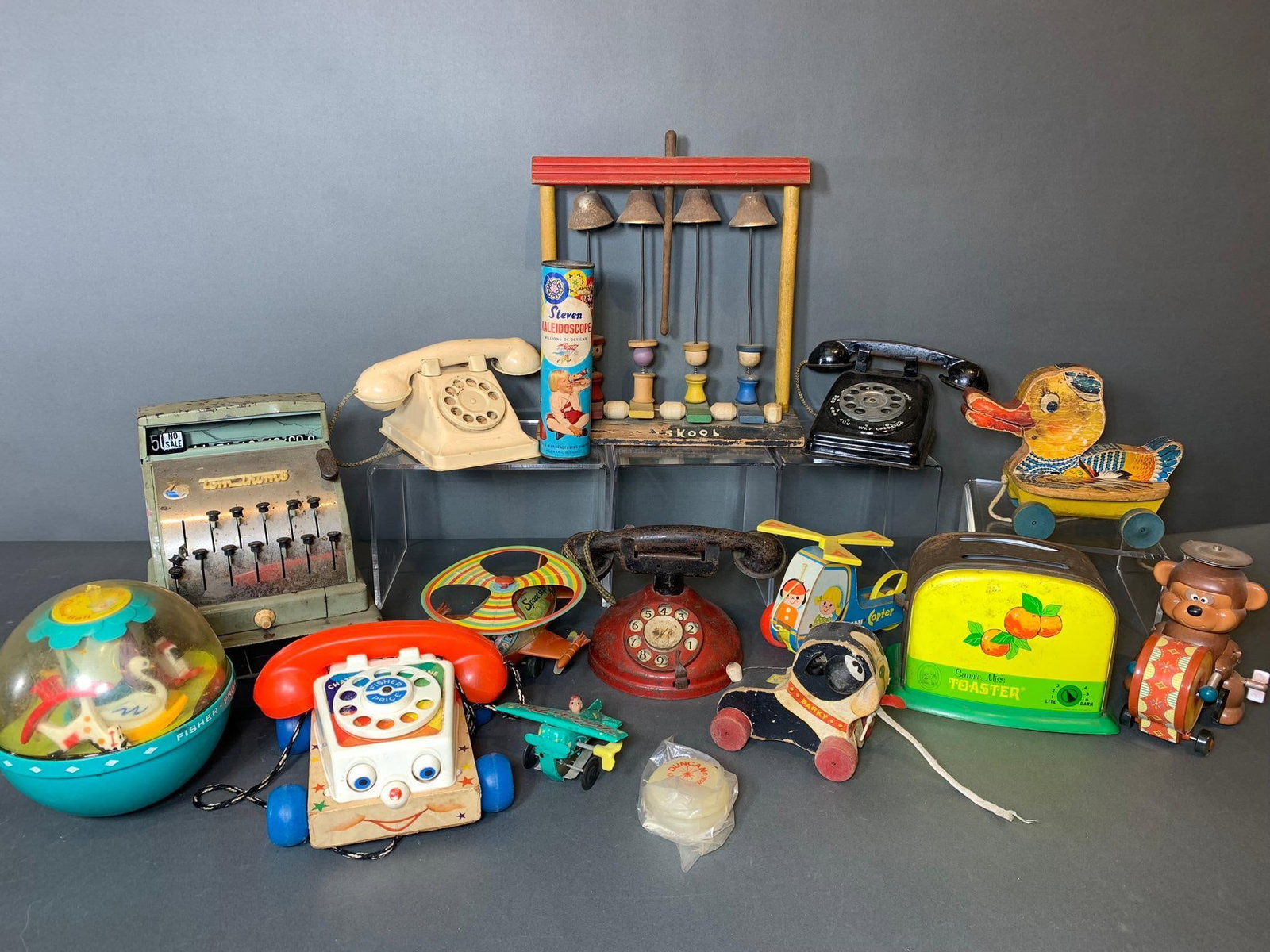Group Lot of Vintage Toy Telephones, Pull Toys, Helicopters, Playskool and More: In-house shipping available. Pickup is Wednesday, April 30 from 1 pm to 7 pm at our offices in Lancaster, OH 43130 or we will provide in-house shipping for this item. We charge a $5/lot fee if you pic
